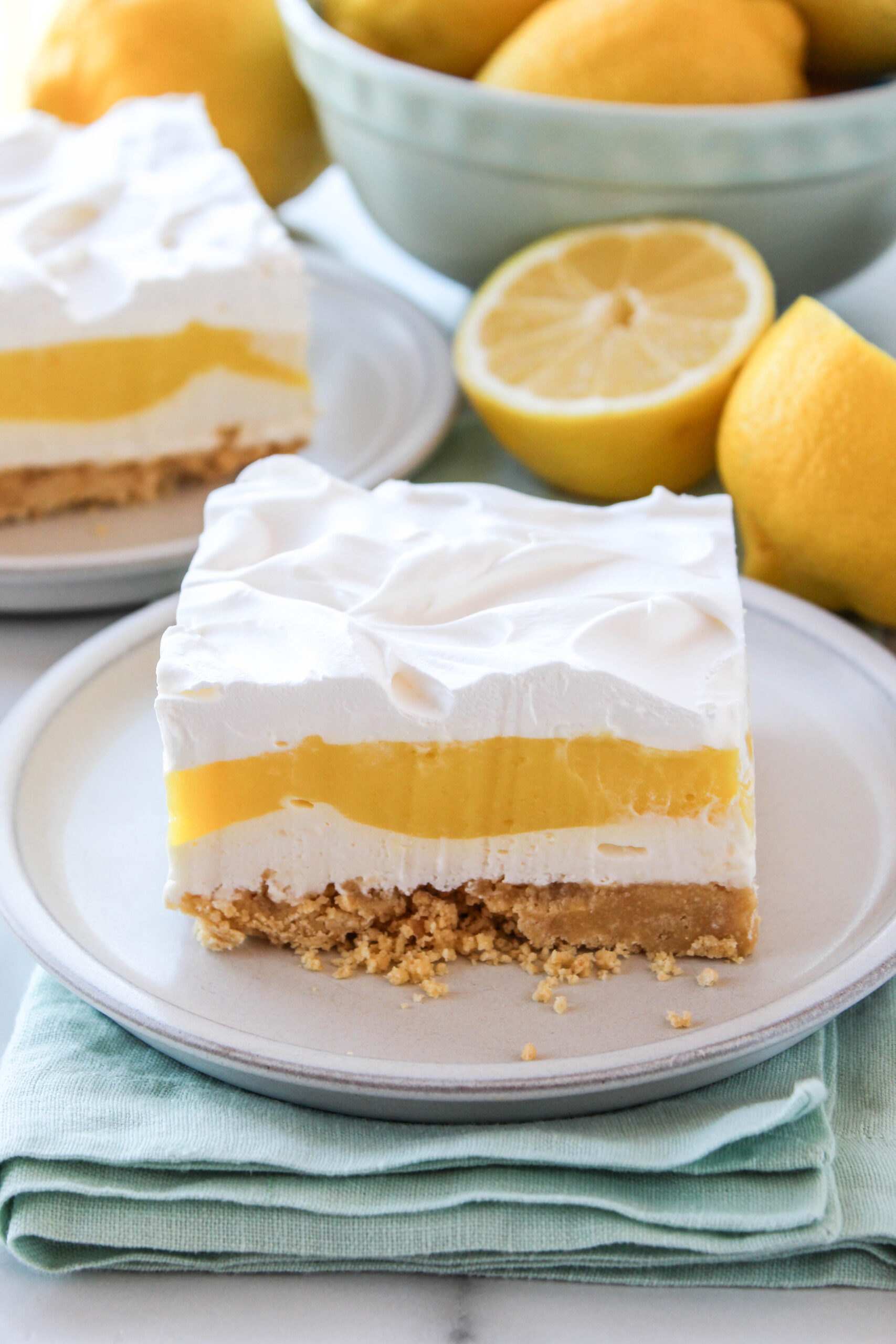 Detailed view of lemon lasagna layers with cookie crust and smooth lemon cream