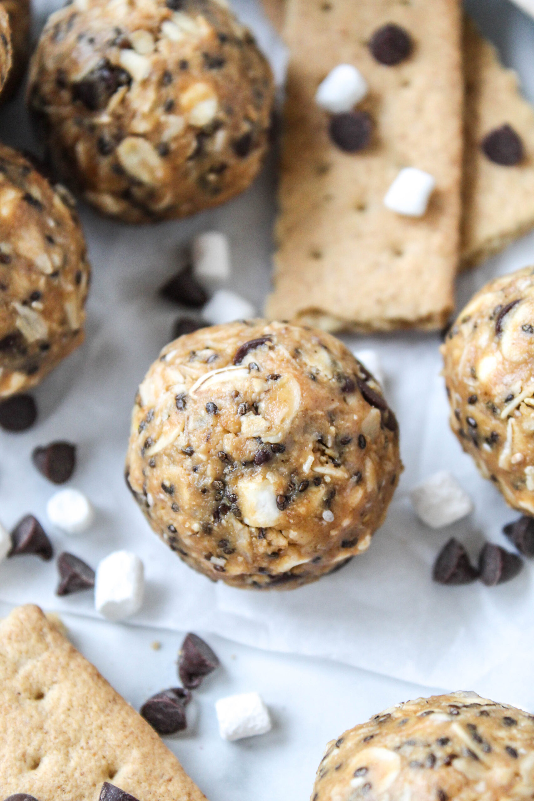 S’mores energy bites made with oats, chocolate chips, marshmallows, and graham crackers