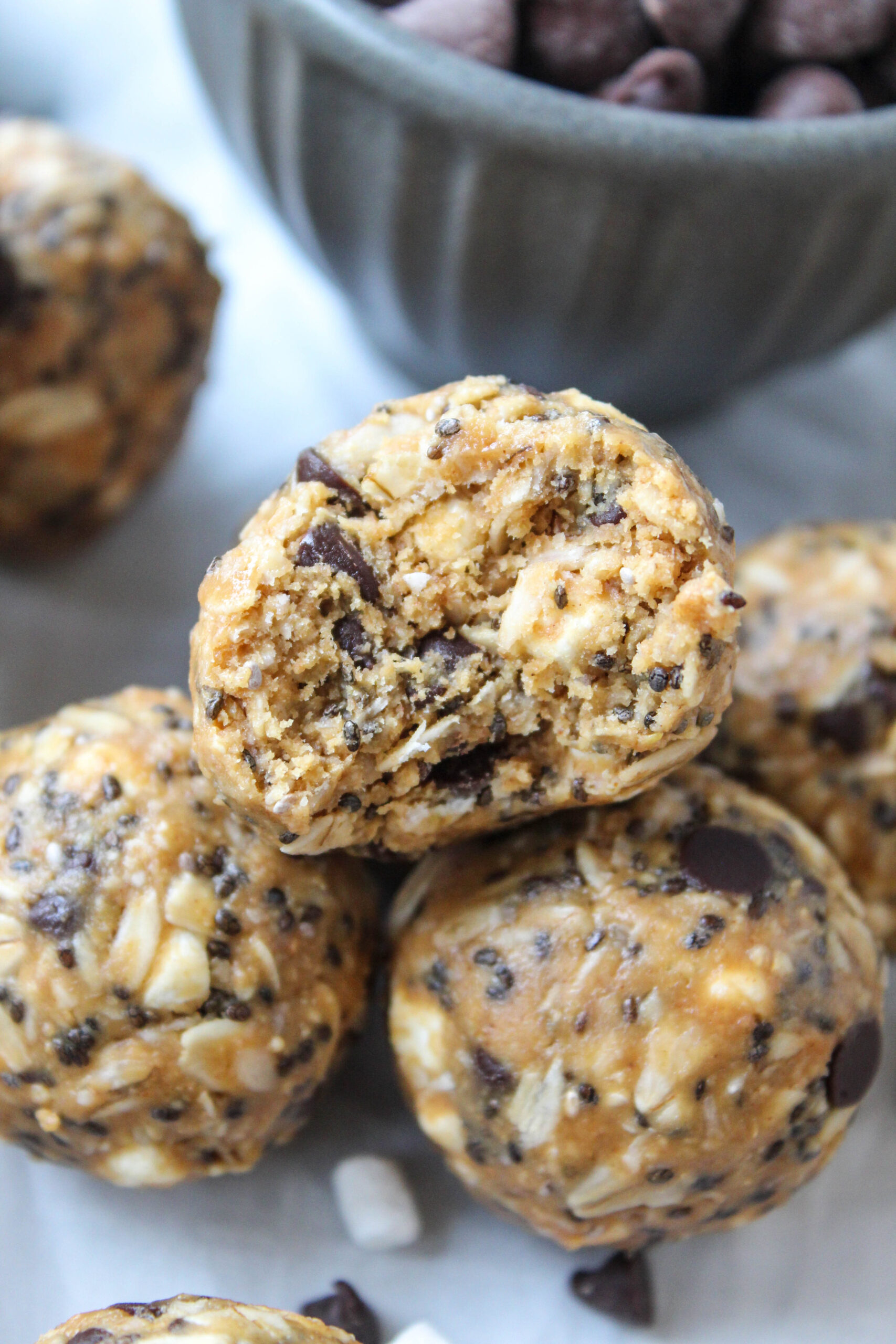 Close-up of chewy s’mores energy balls with oats, marshmallow bits, and graham cracker crumbs