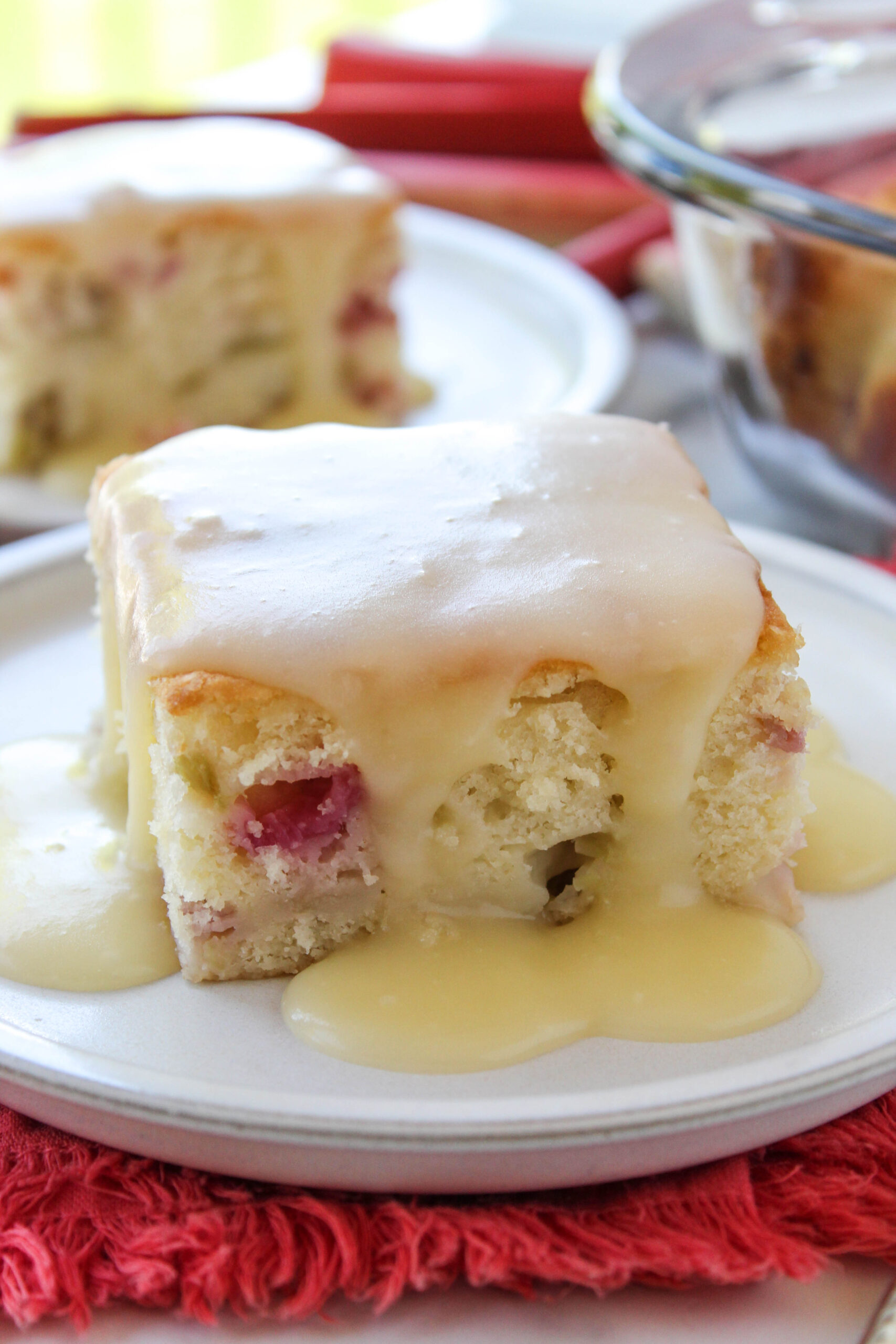 Homemade rhubarb cake drizzled with vanilla butter sauce