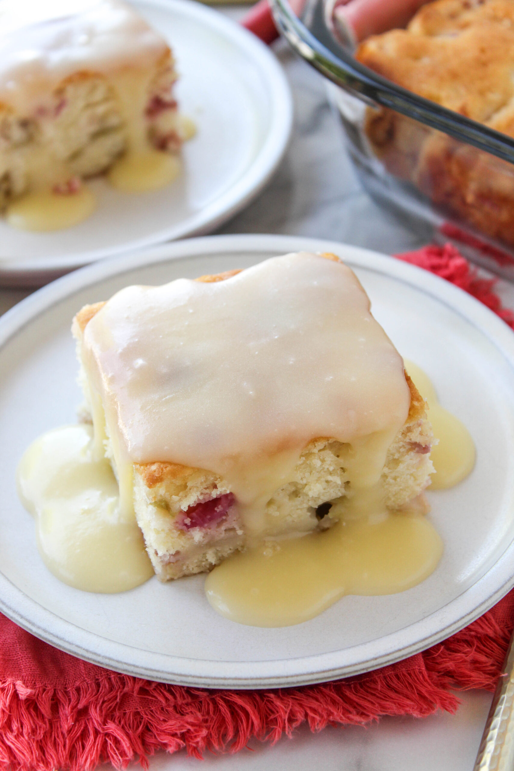 Moist rhubarb cake topped with melted butter sauce
