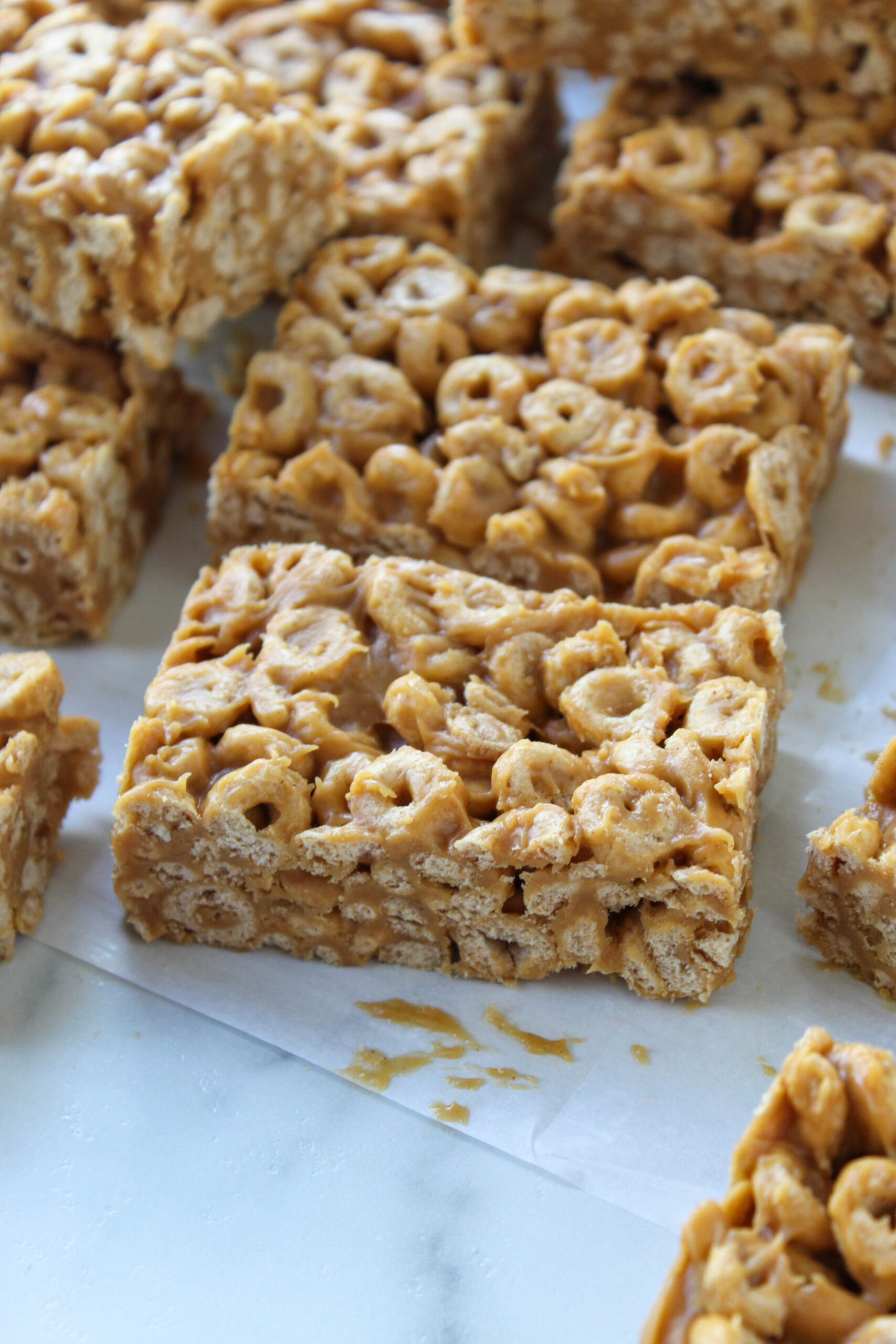 Homemade peanut butter Cheerio bars cut into squares