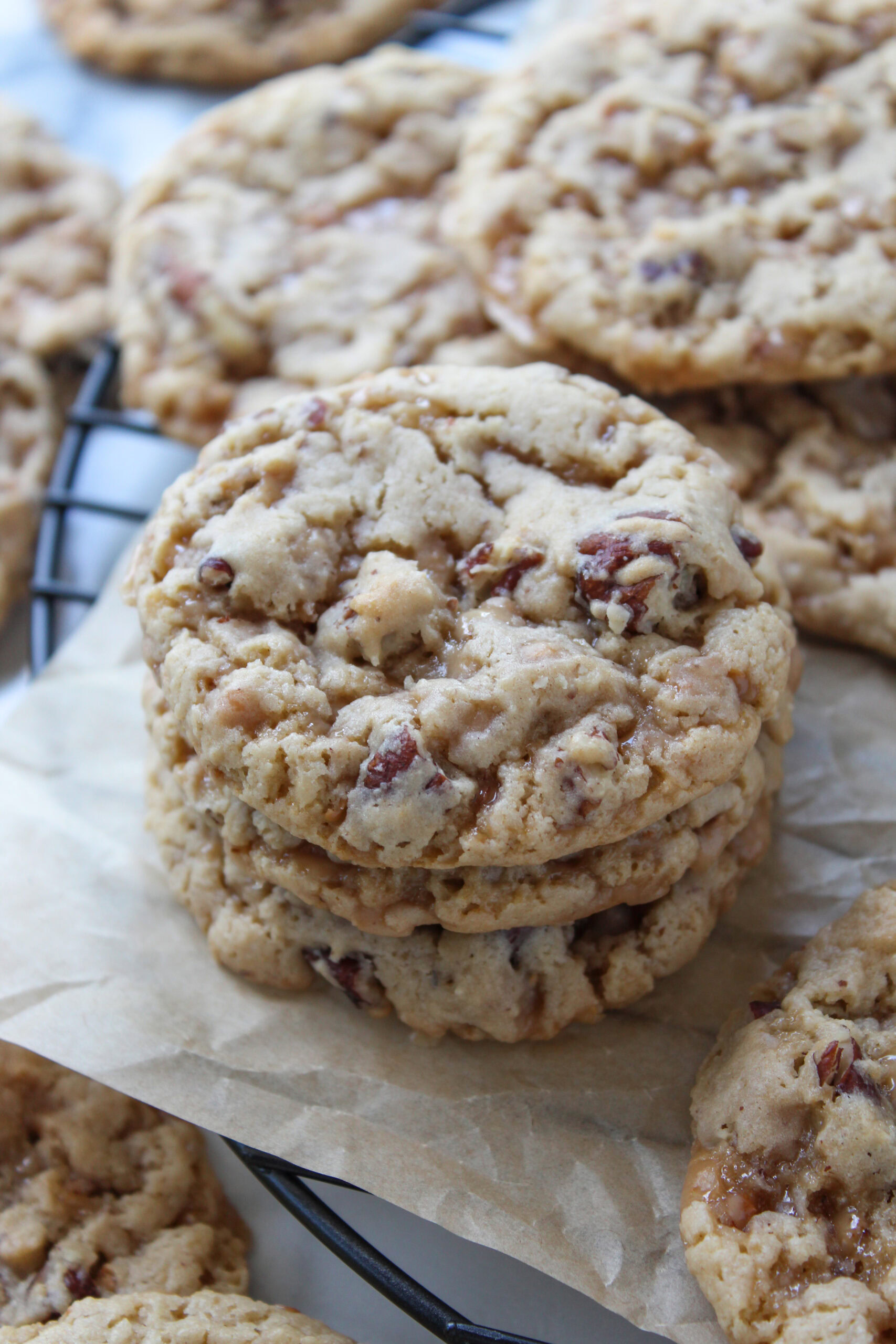 Close-up of buttery cake mix cookies loaded with toffee bits and pecans