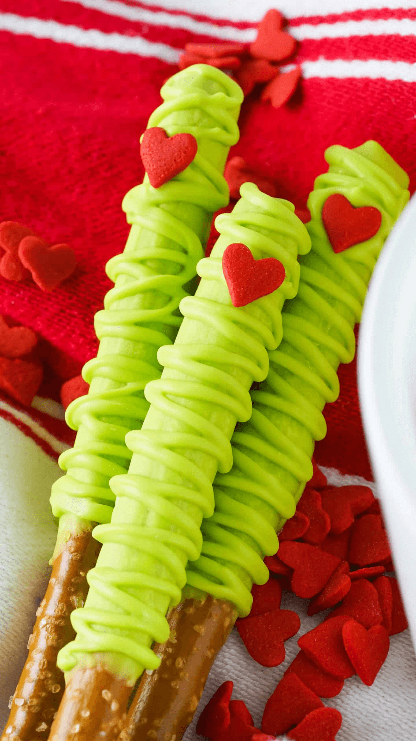 Grinch-themed dessert table filled with festive Christmas treats