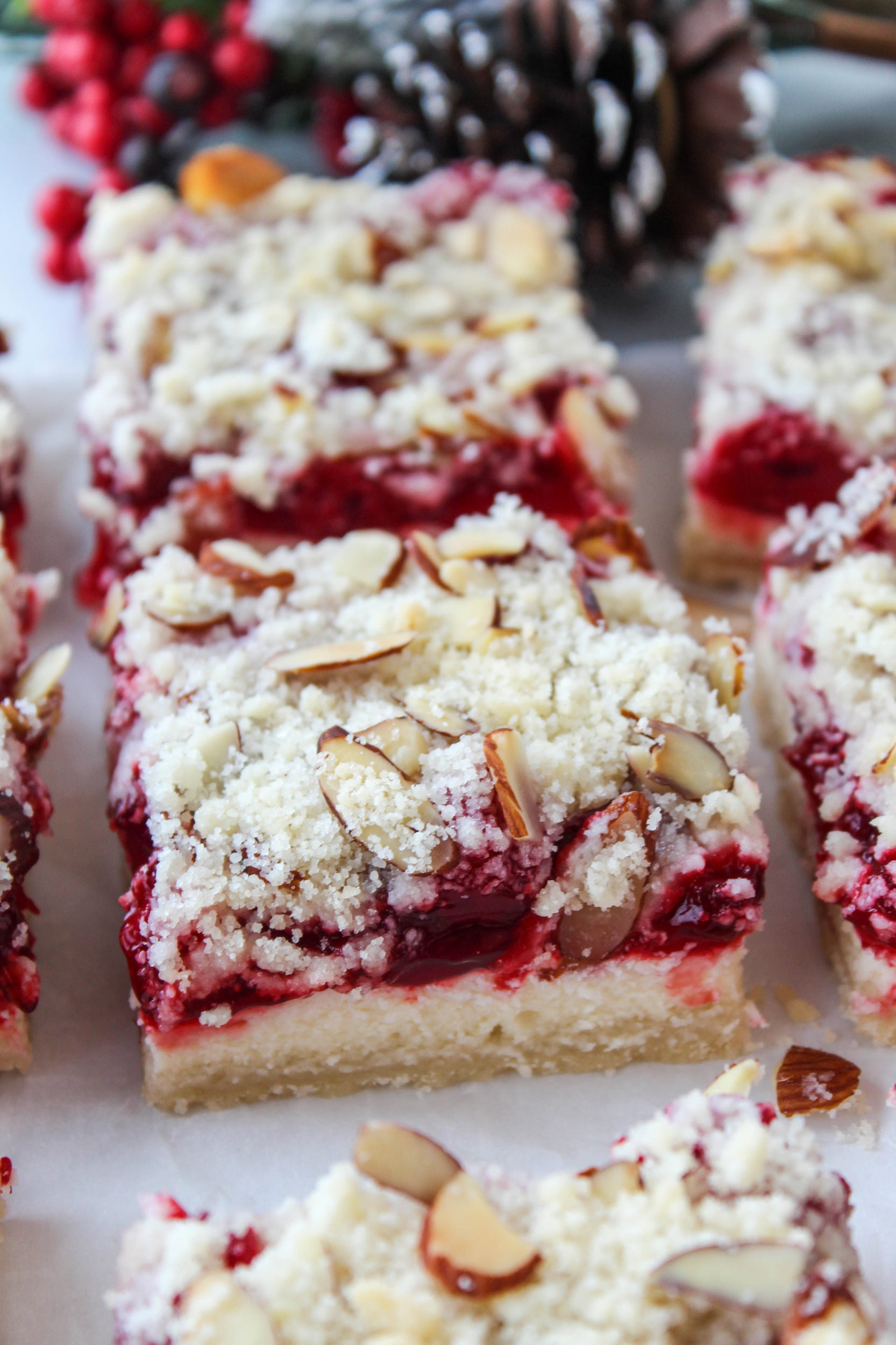 Festive holiday cheesecake dessert bars for Christmas gatherings and parties.