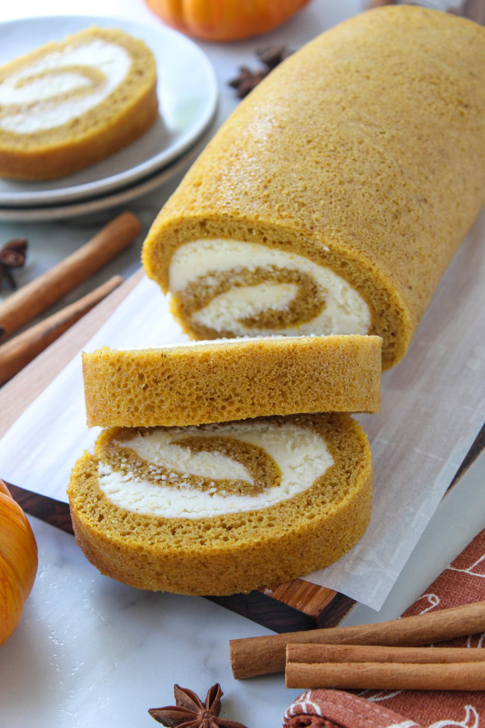 Pumpkin roll with creamy, sweet cream cheese filling and a soft spiced cake