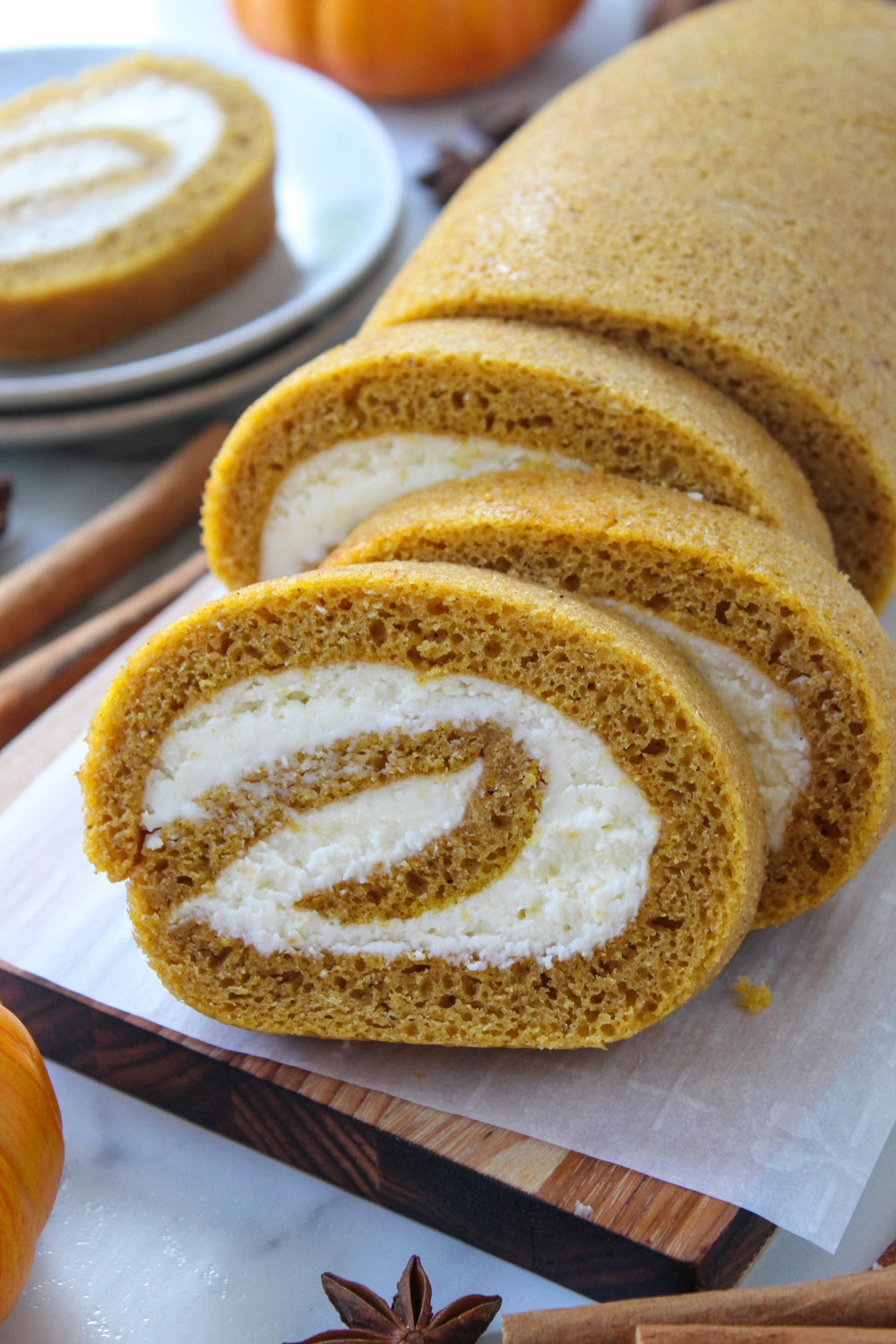 Pumpkin roll with cinnamon‑spiced cake and tangy cream cheese filling