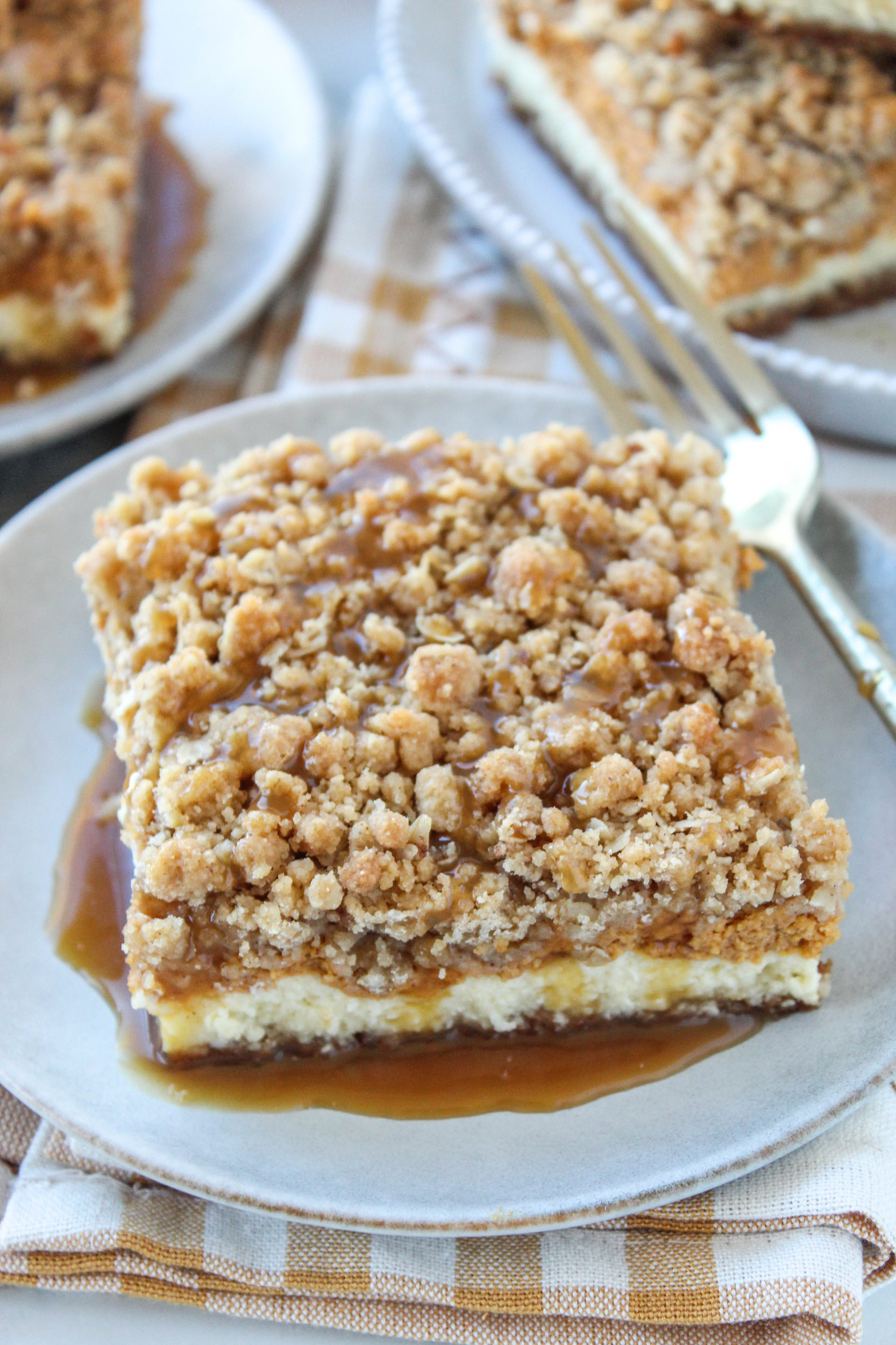 Homemade pumpkin caramel cheesecake bars sliced into dessert squares