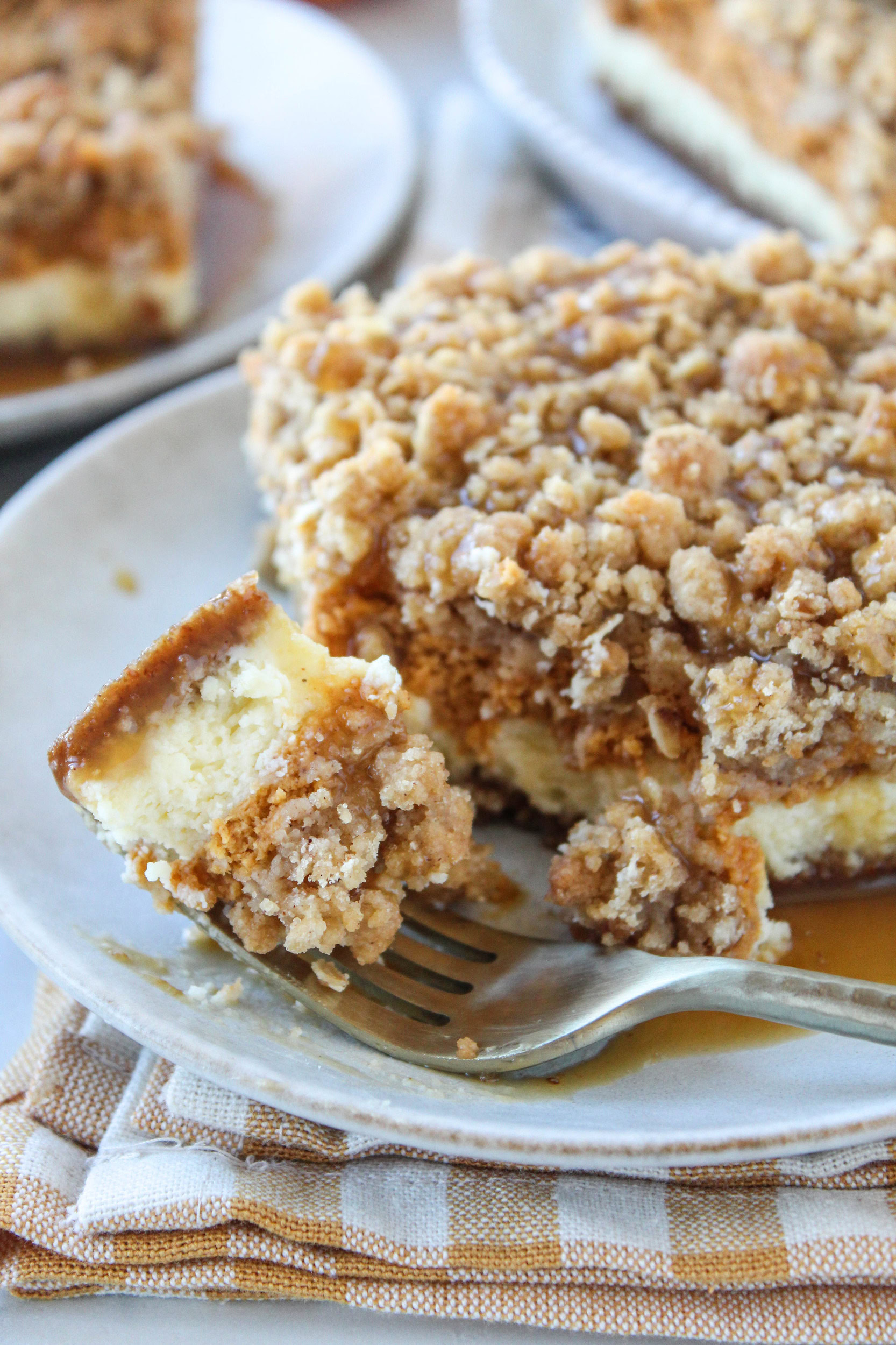 Easy pumpkin cheesecake bars layered with caramel sauce