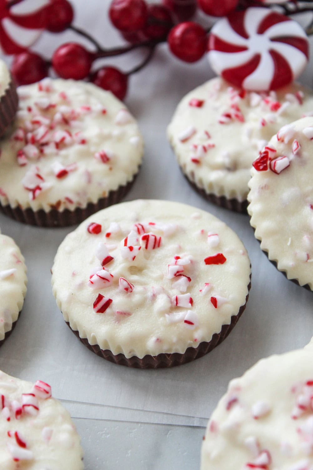 Easy peppermint bark cups decorated with festive candy cane pieces