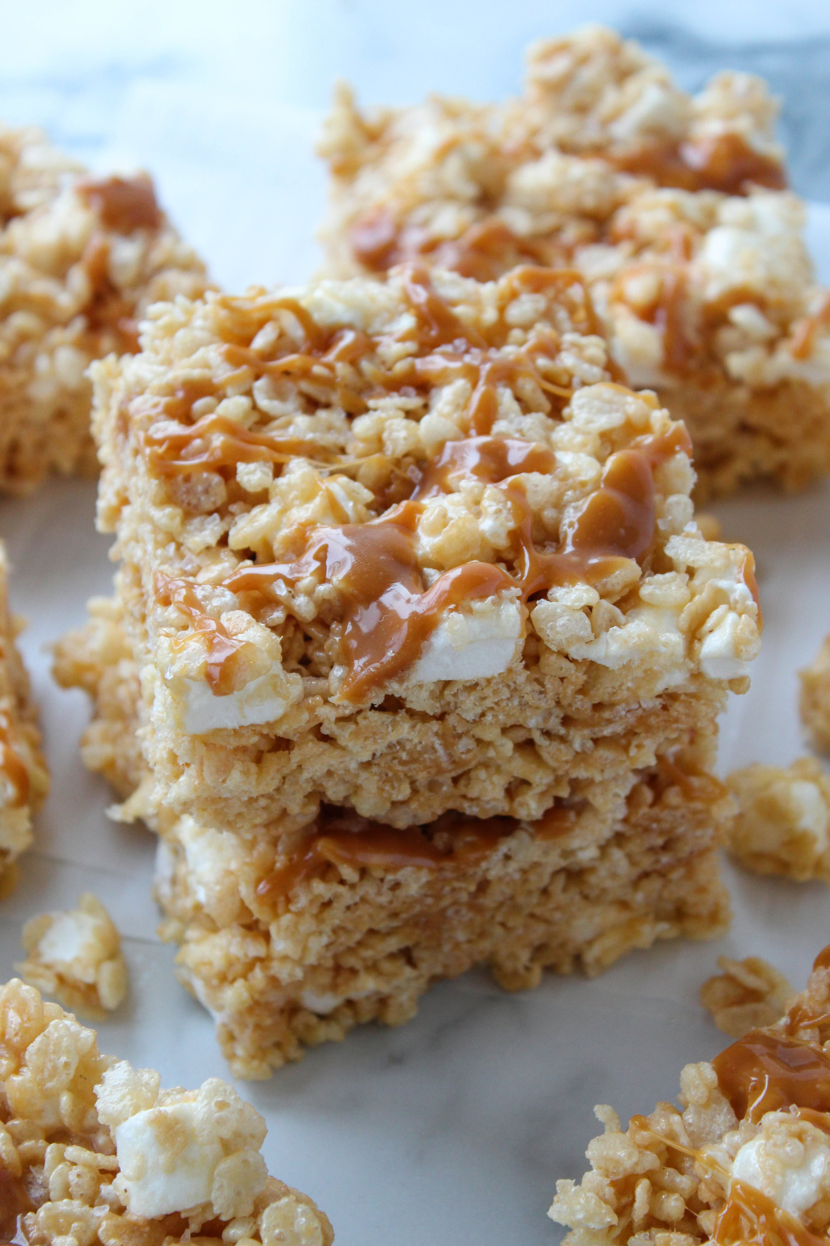Overhead view of caramel rice krispie treats on parchment paper