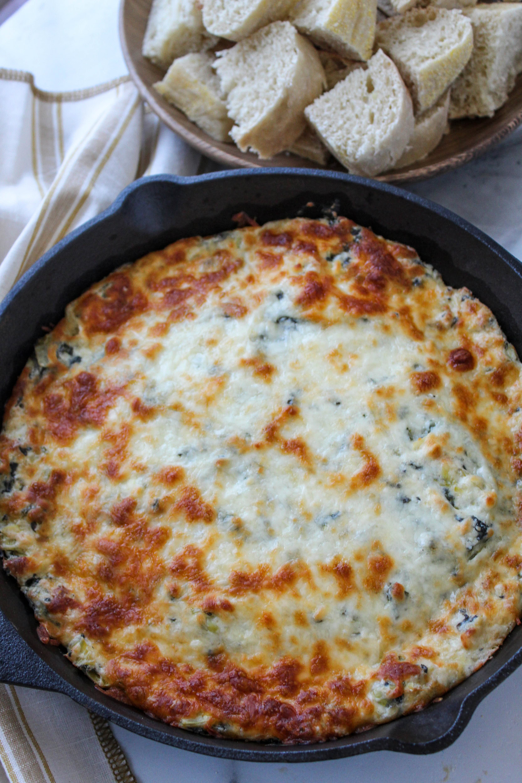 Hot spinach artichoke dip bubbling around the edges