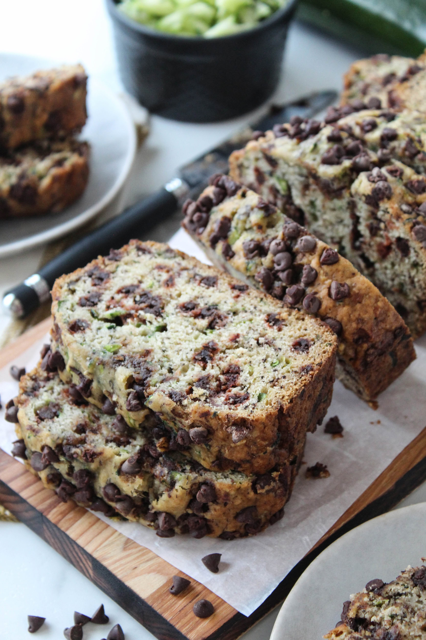 Sliced chocolate chip zucchini bread showing a moist texture with melted chocolate chips