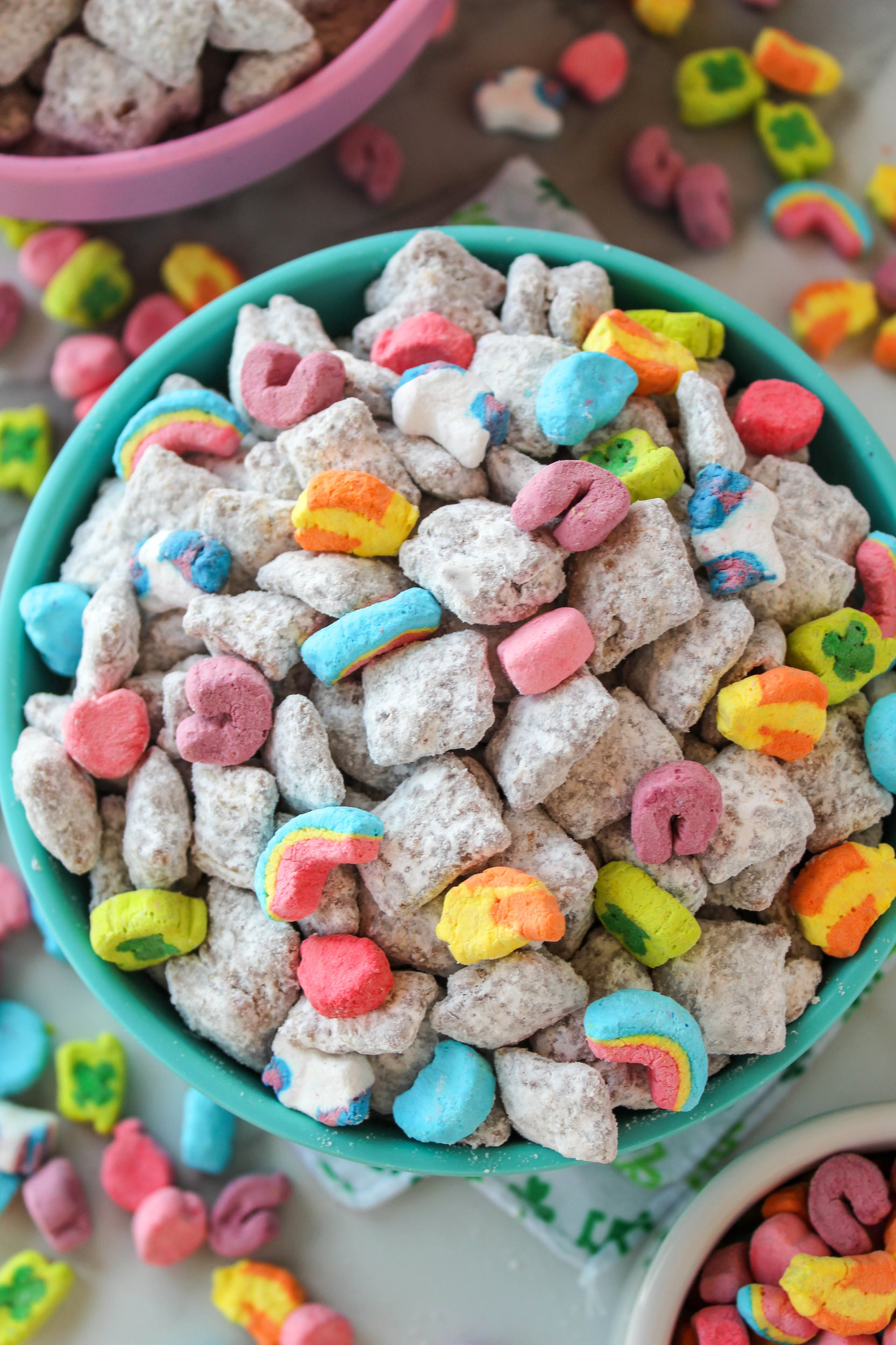 Close-up of crunchy puppy chow made with Chex cereal, chocolate, powdered sugar, and Lucky Charms marshmallows