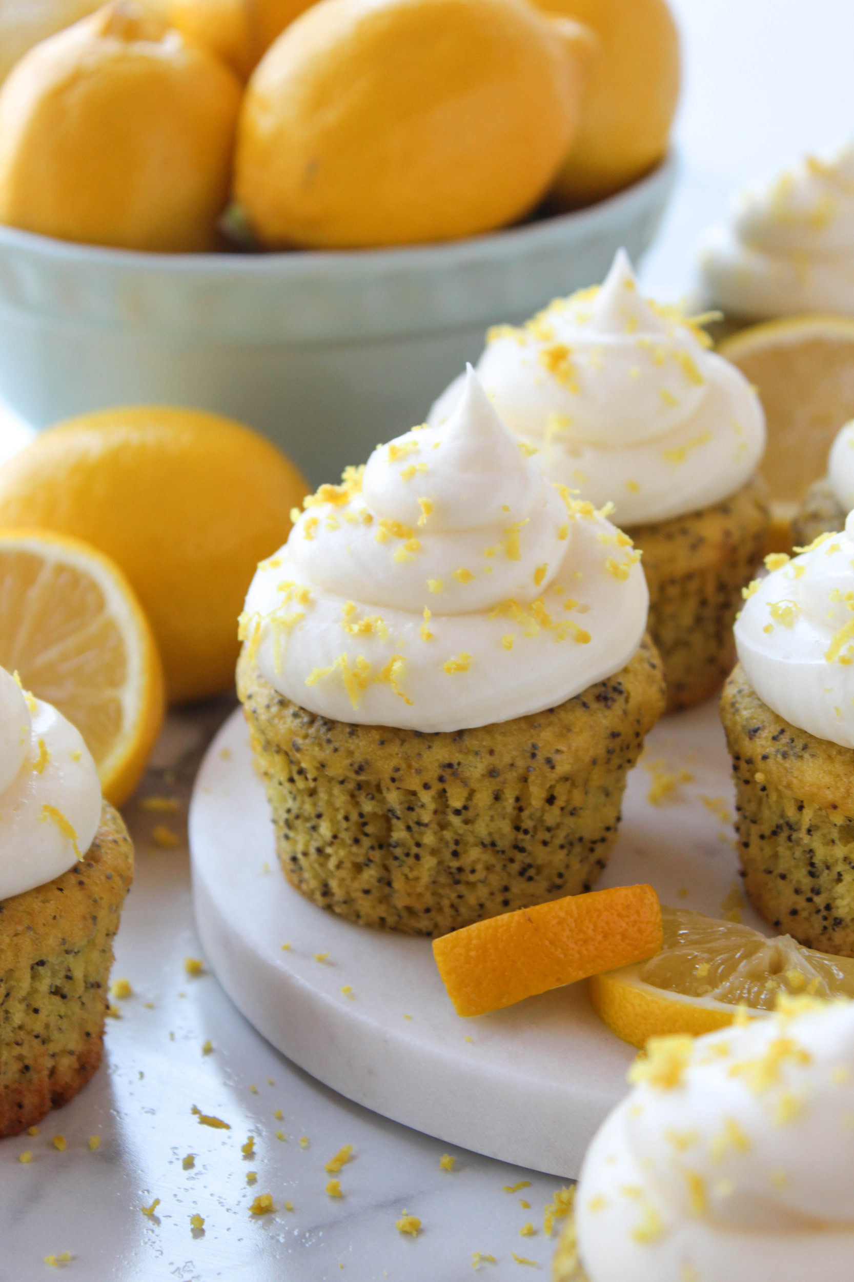 Lemon poppy seed cupcakes made with cake mix topped with lemon cream cheese frosting