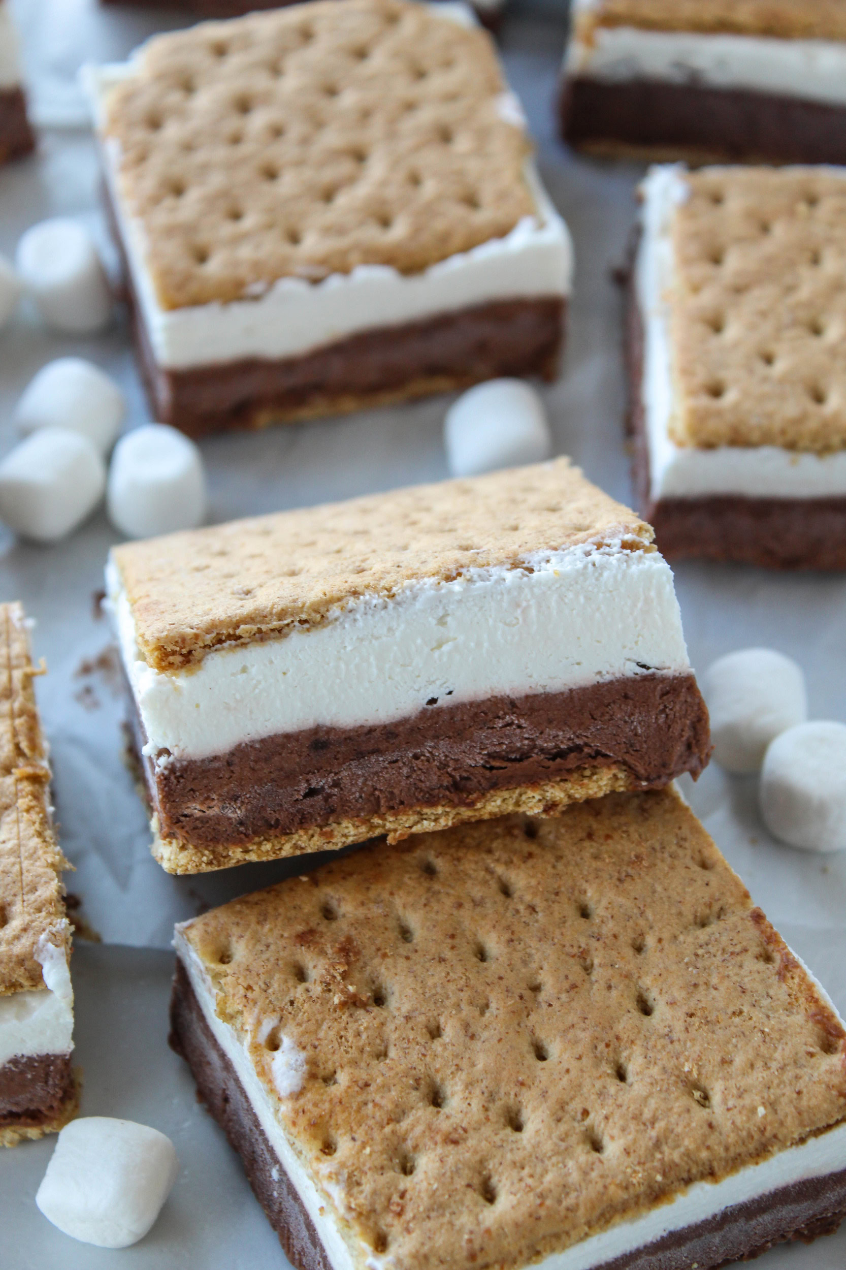 Homemade frozen s’mores squares layered with chocolate pudding and marshmallow on graham crackers