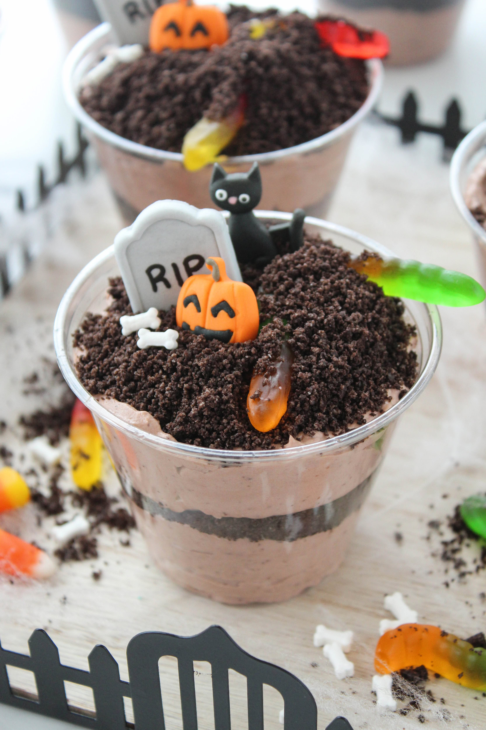 Easy Halloween Oreo dirt cups served in clear dessert cups