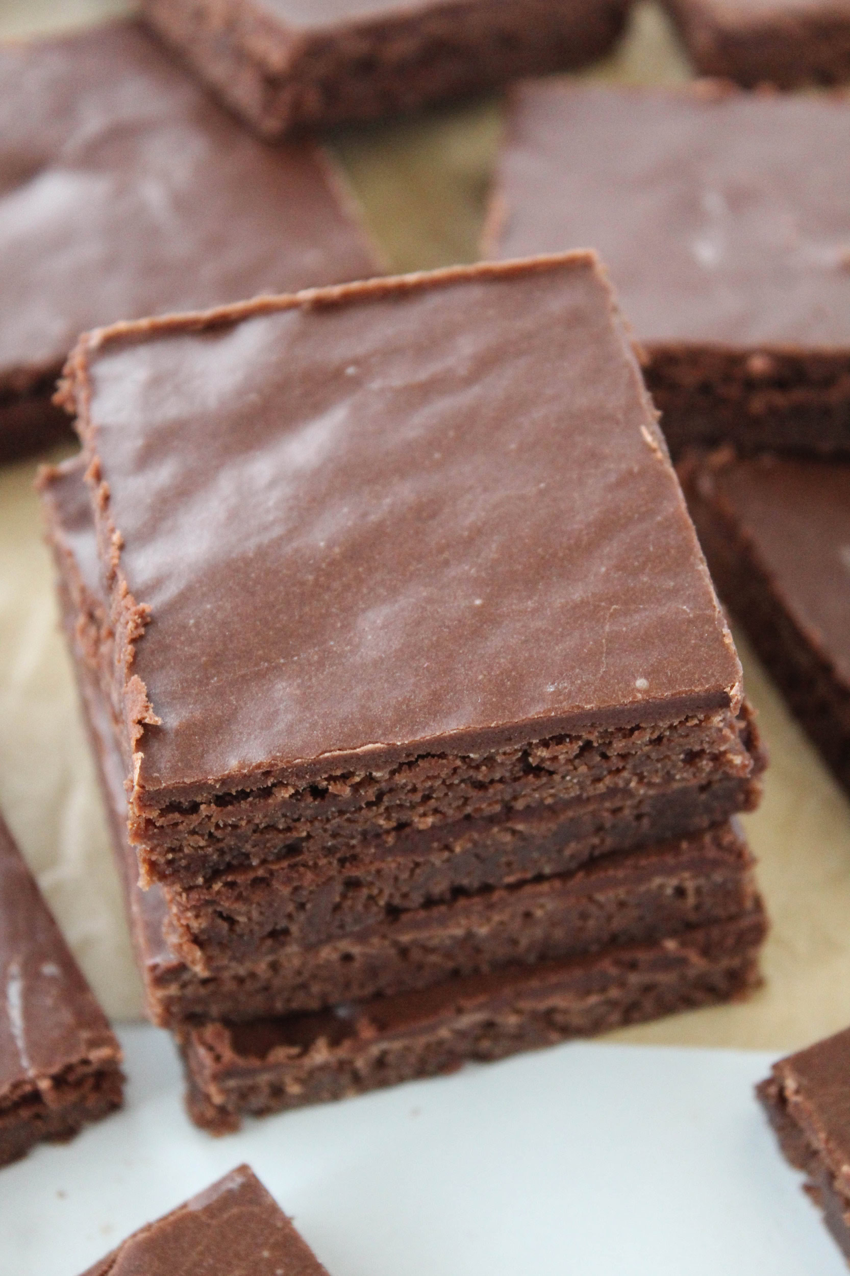 Sheet pan brownies topped with chocolate frosting