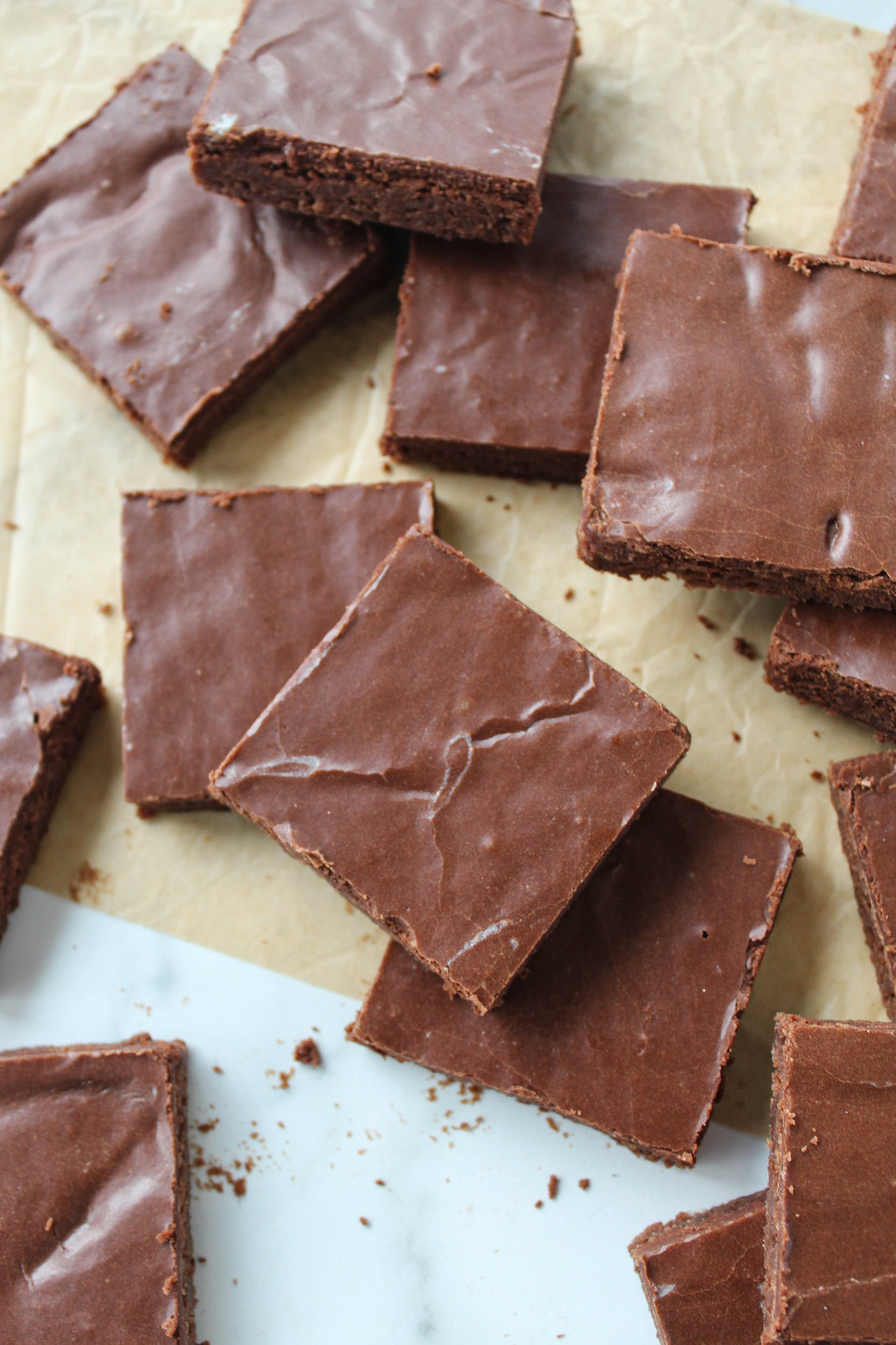 Homemade sheet pan brownies covered with rich chocolate frosting