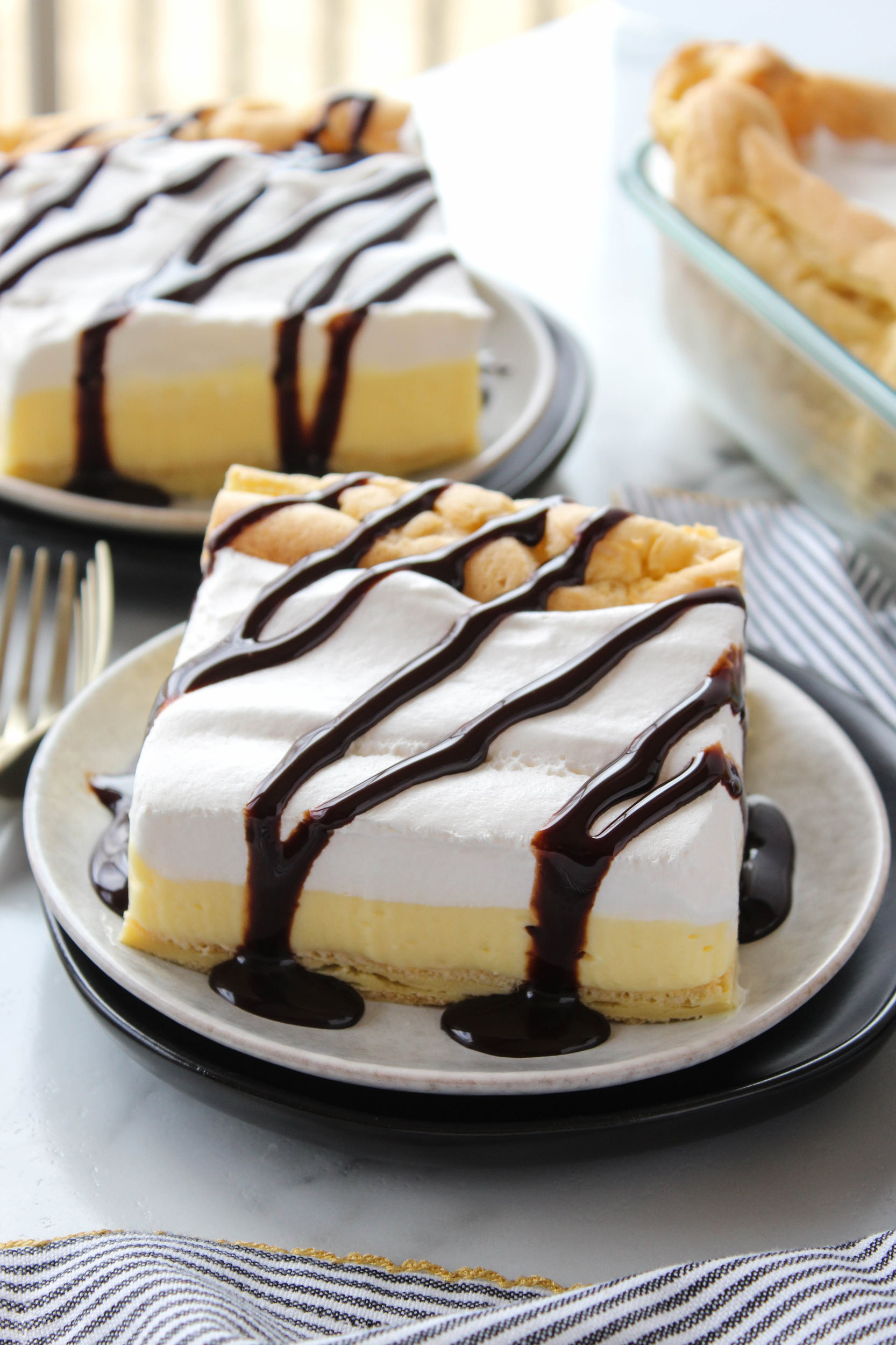 Cream puff cake with creamy filling and whipped topping
