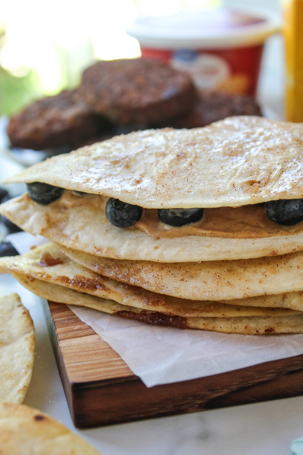 Crispy breakfast quesadilla filled with fresh blueberries and served warm