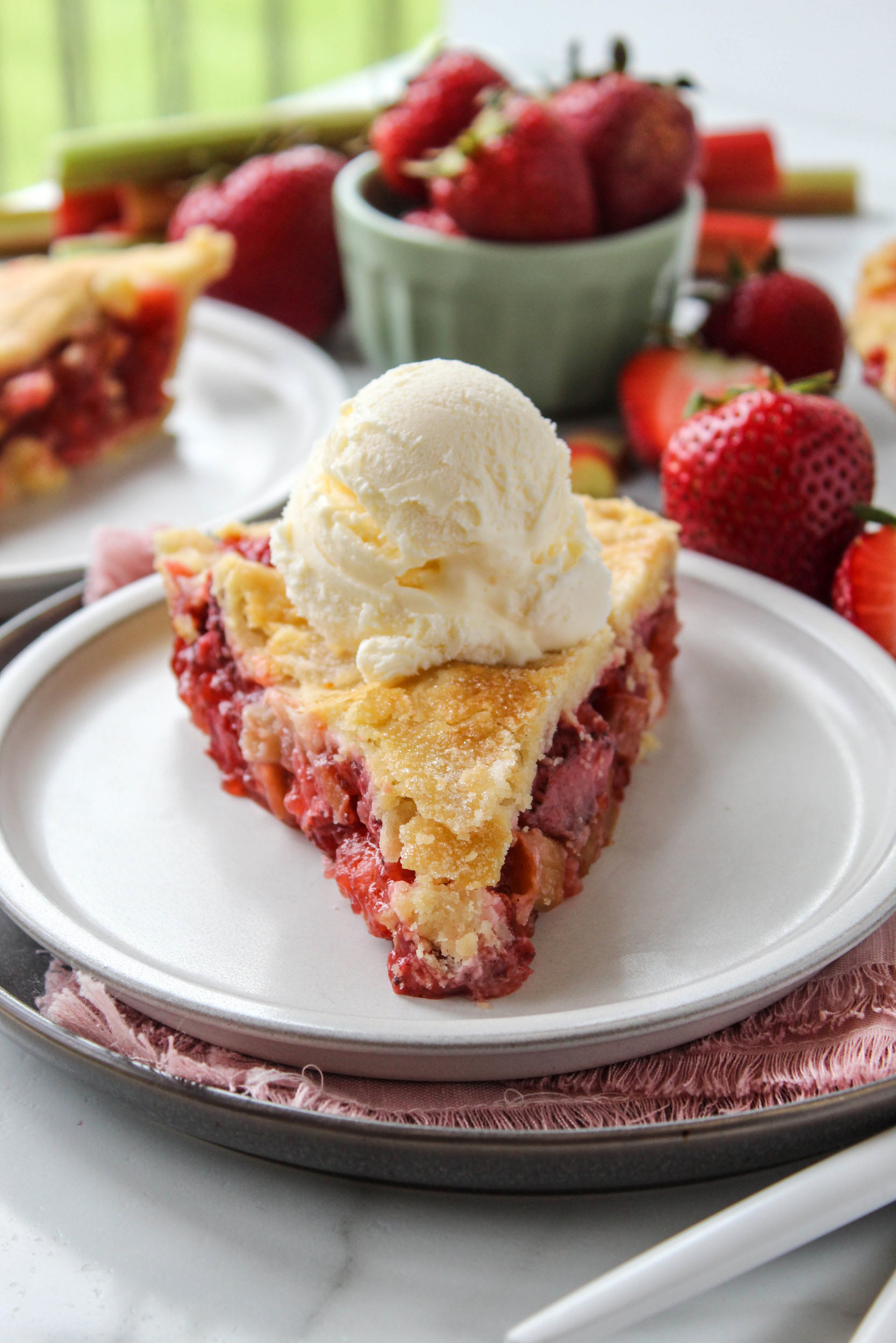 Strawberry rhubarb pie with a flaky golden crust