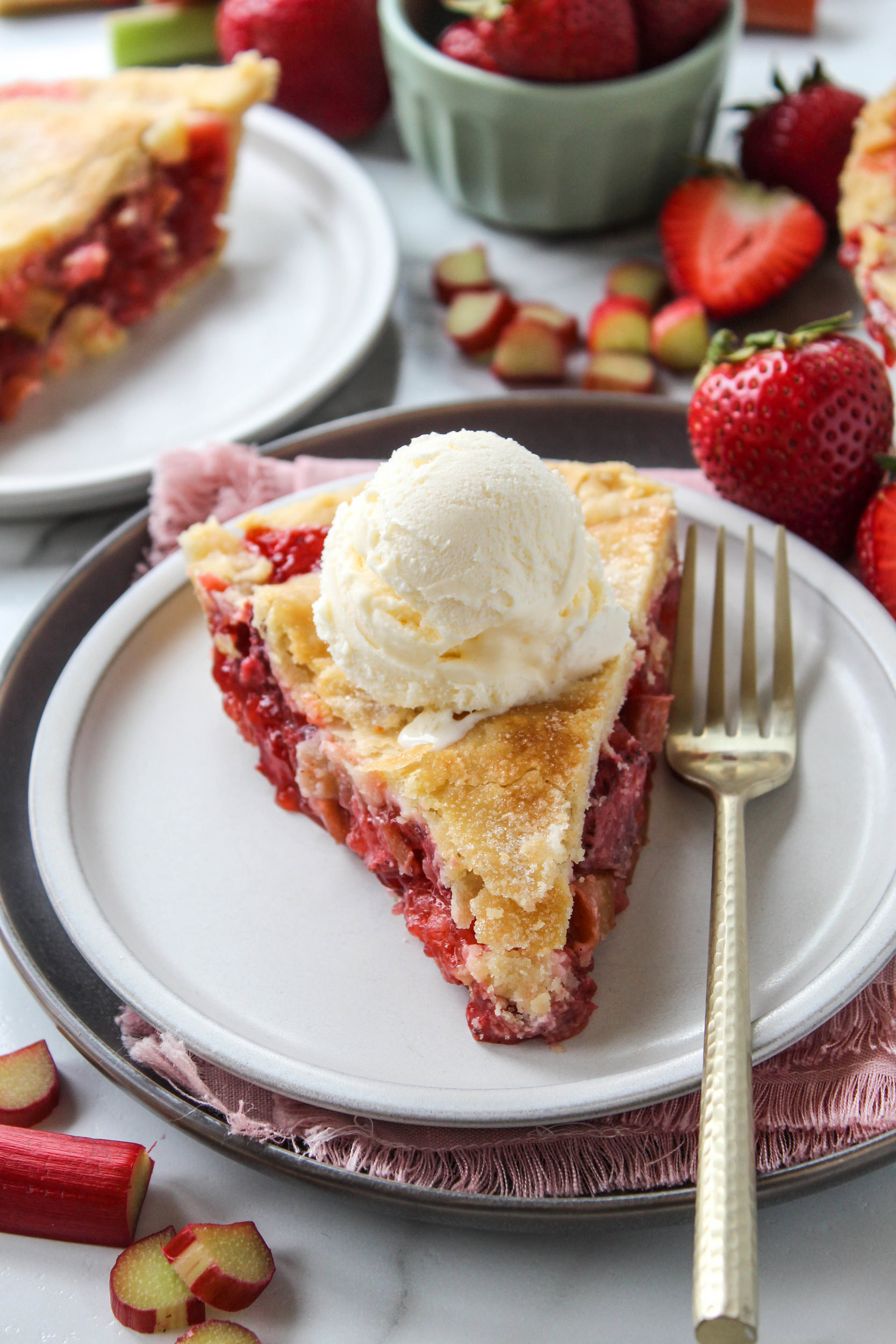 Homemade strawberry rhubarb pie with a flaky crust and juicy red filling