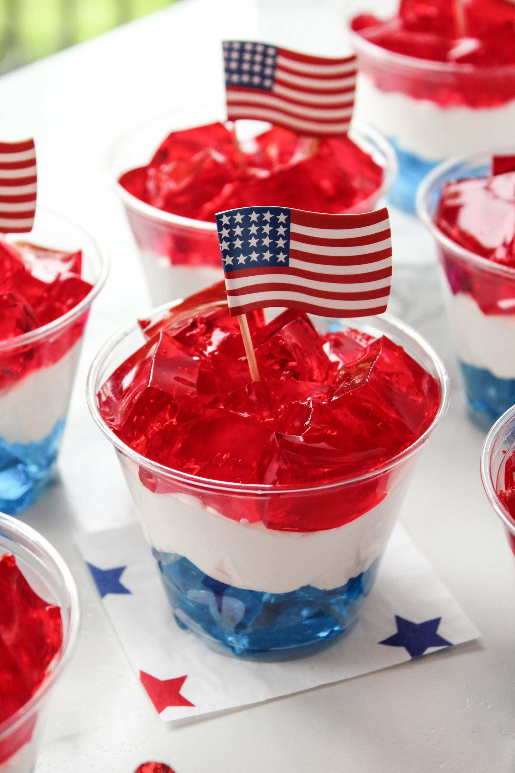 Individually portioned Jell‑O cups with stacked red, white, and blue gelatin layers