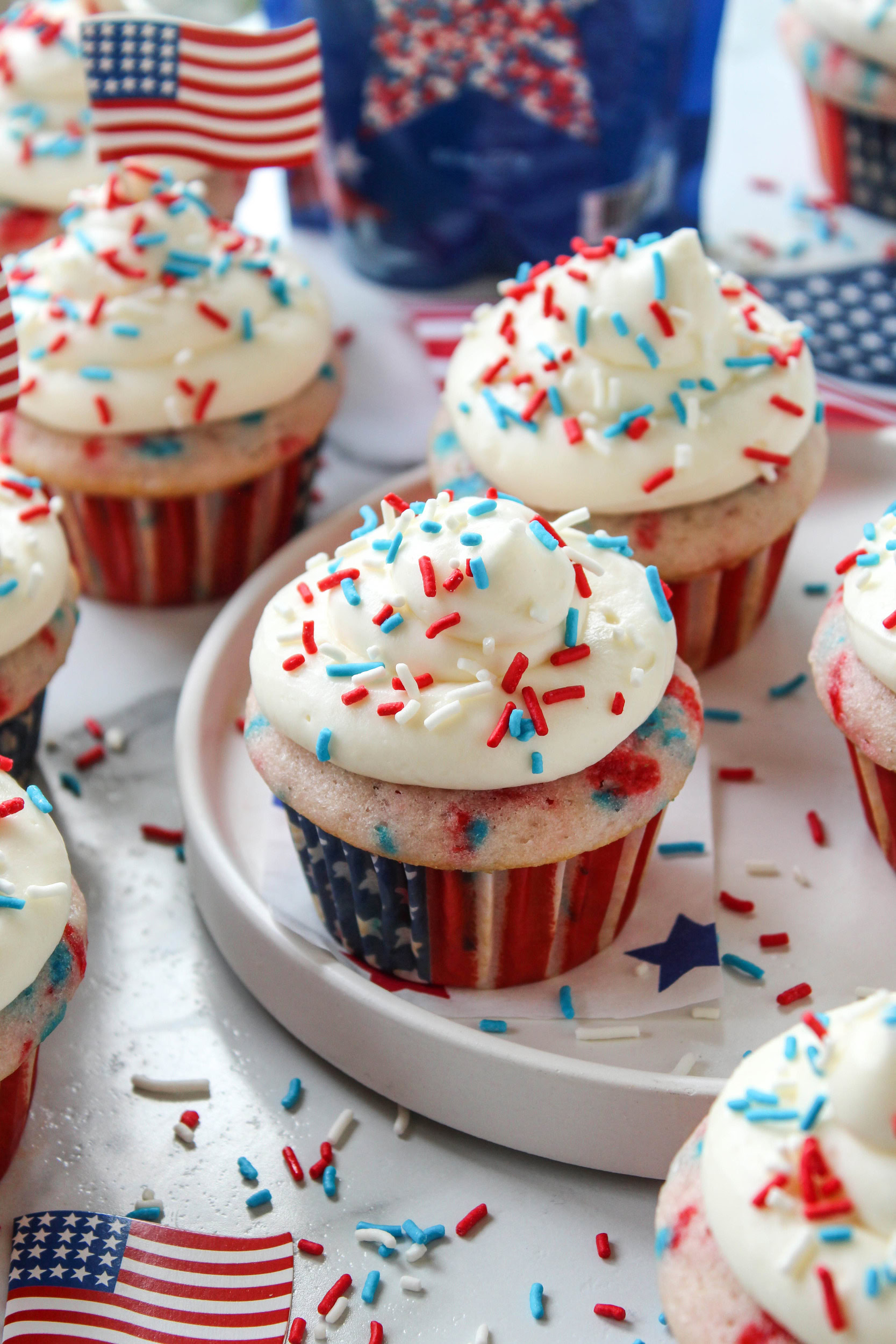 Red, white, and blue cupcakes arranged on a serving tray