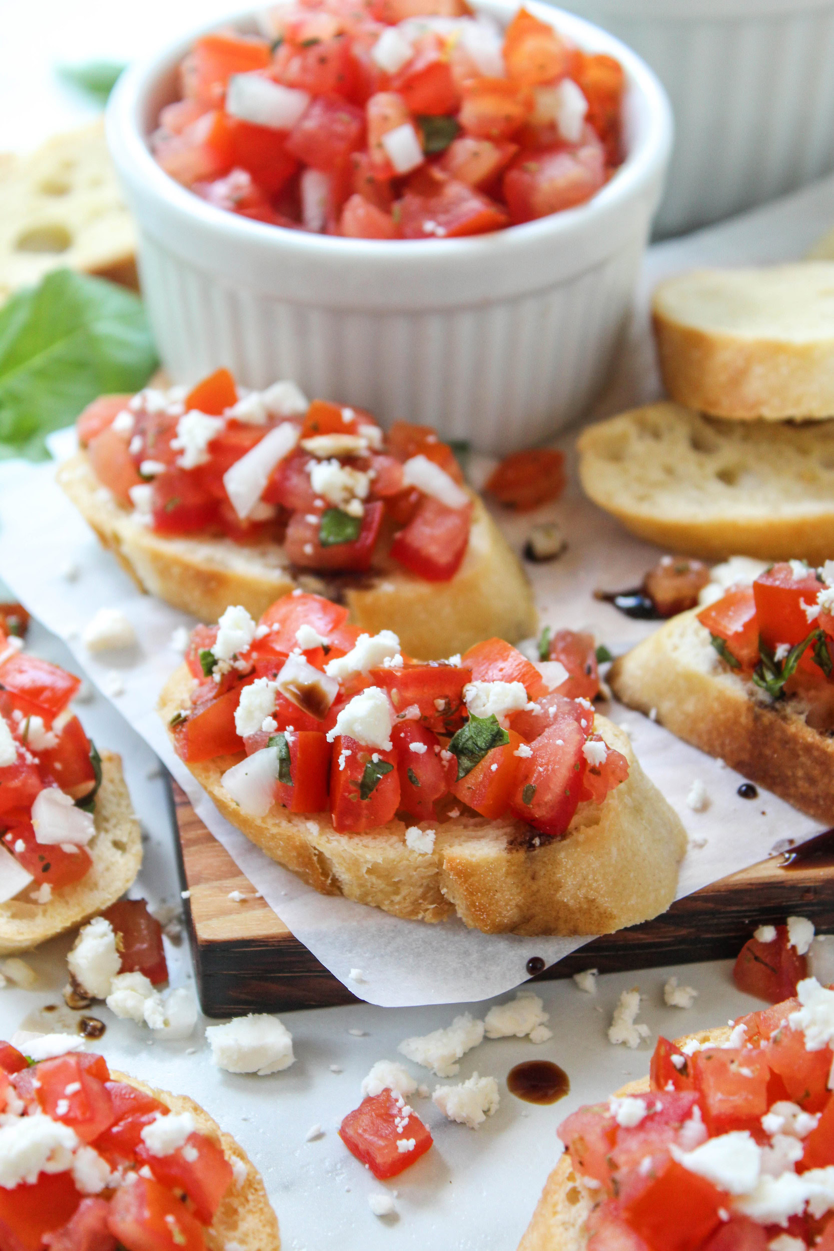 bruschetta topped with diced tomatoes and herbs