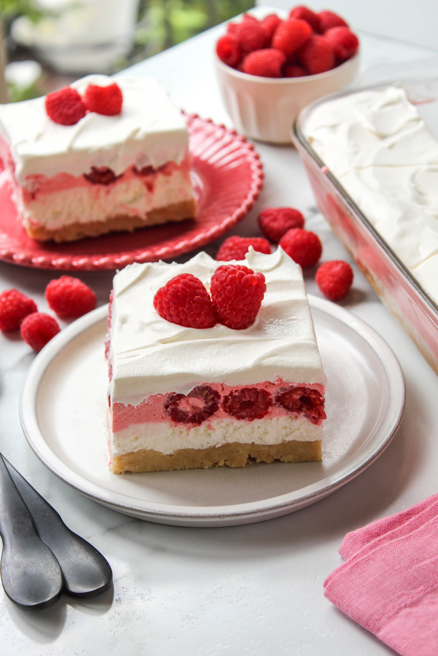 Easy raspberry lasagna dessert served on a white plate