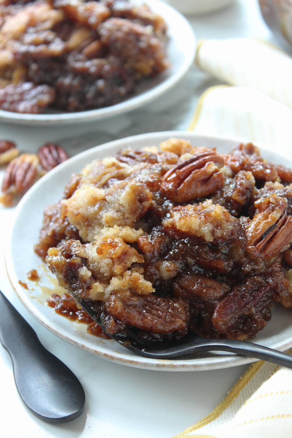 Gooey pecan pie dump cake with soft pecan filling and crisp cake topping