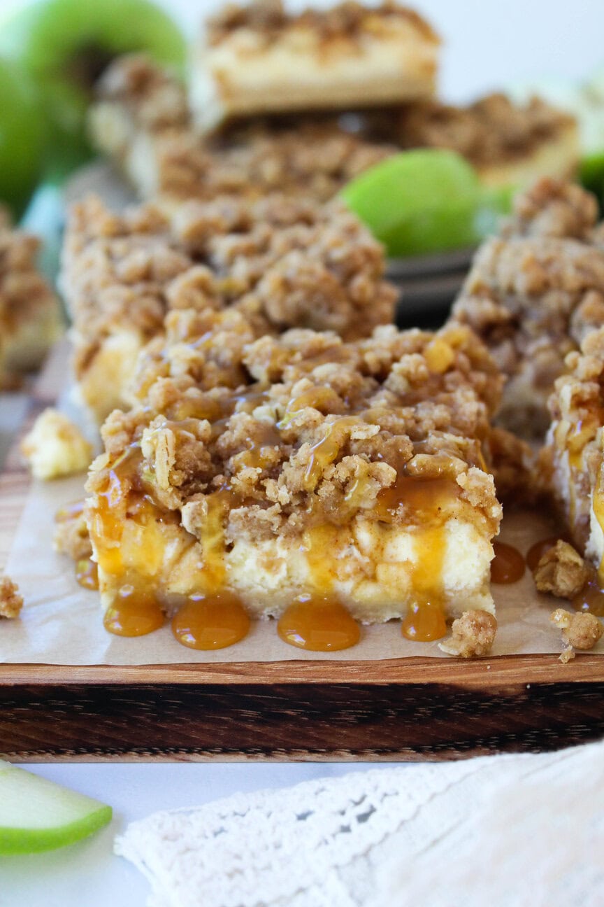 Caramel apple cheesecake bars with golden streusel