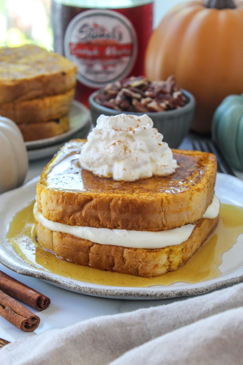 Stuffed pumpkin French toast on a rustic fall table setting