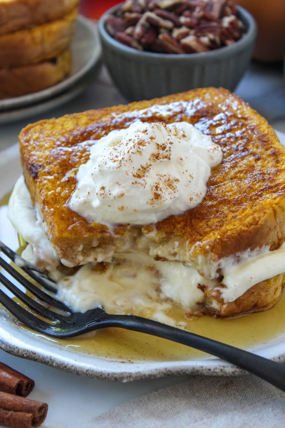 Pumpkin French toast with a fork cutting into the soft center