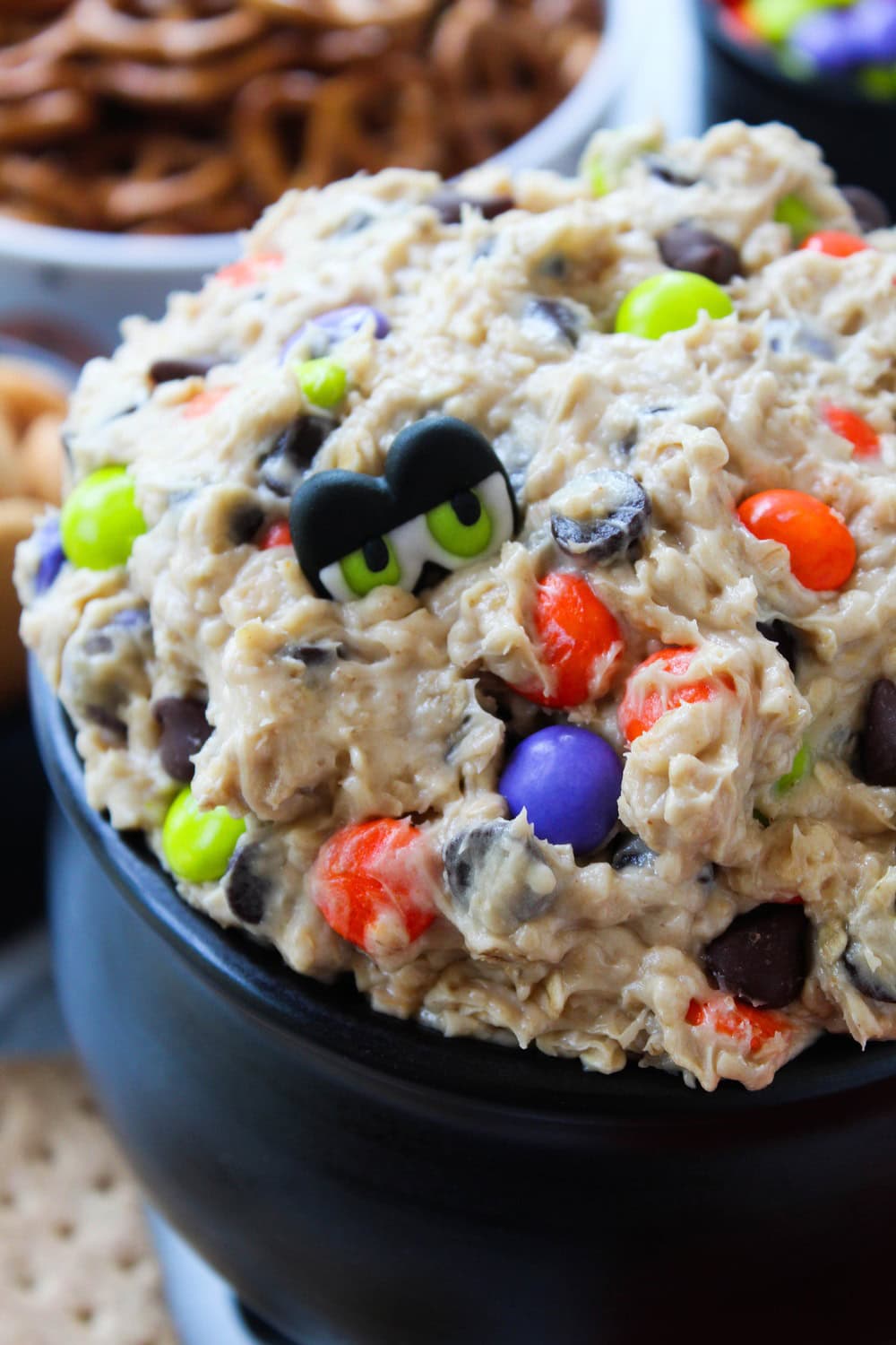 Easy Halloween monster dip topped with candy eyeballs and chocolate chips