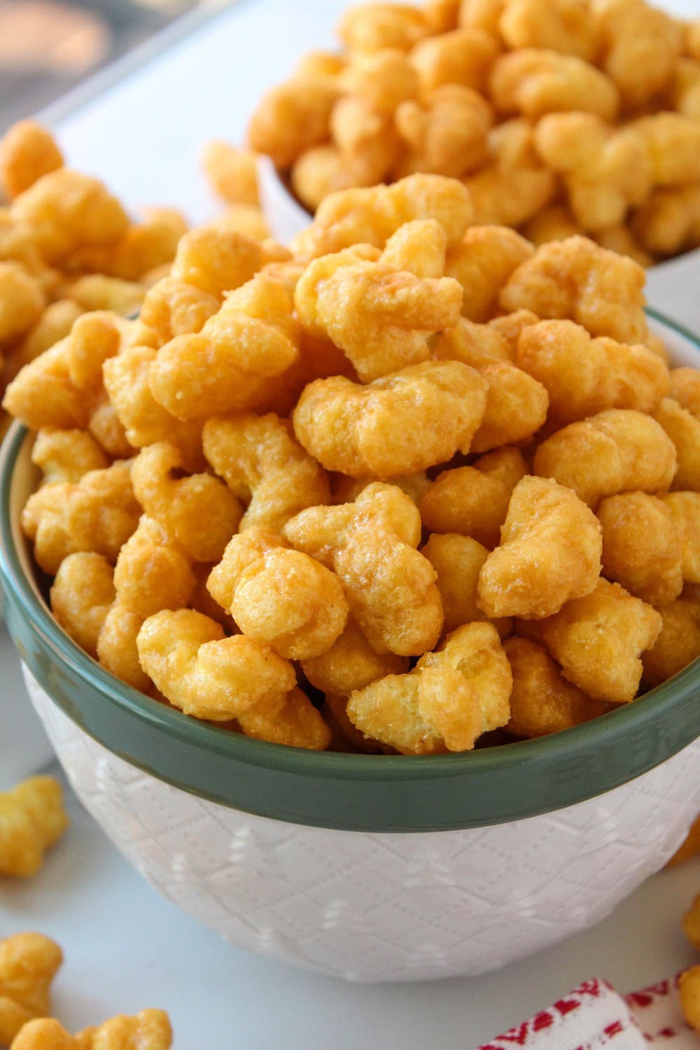 Close‑up of caramel puff corn showing light, airy crunch