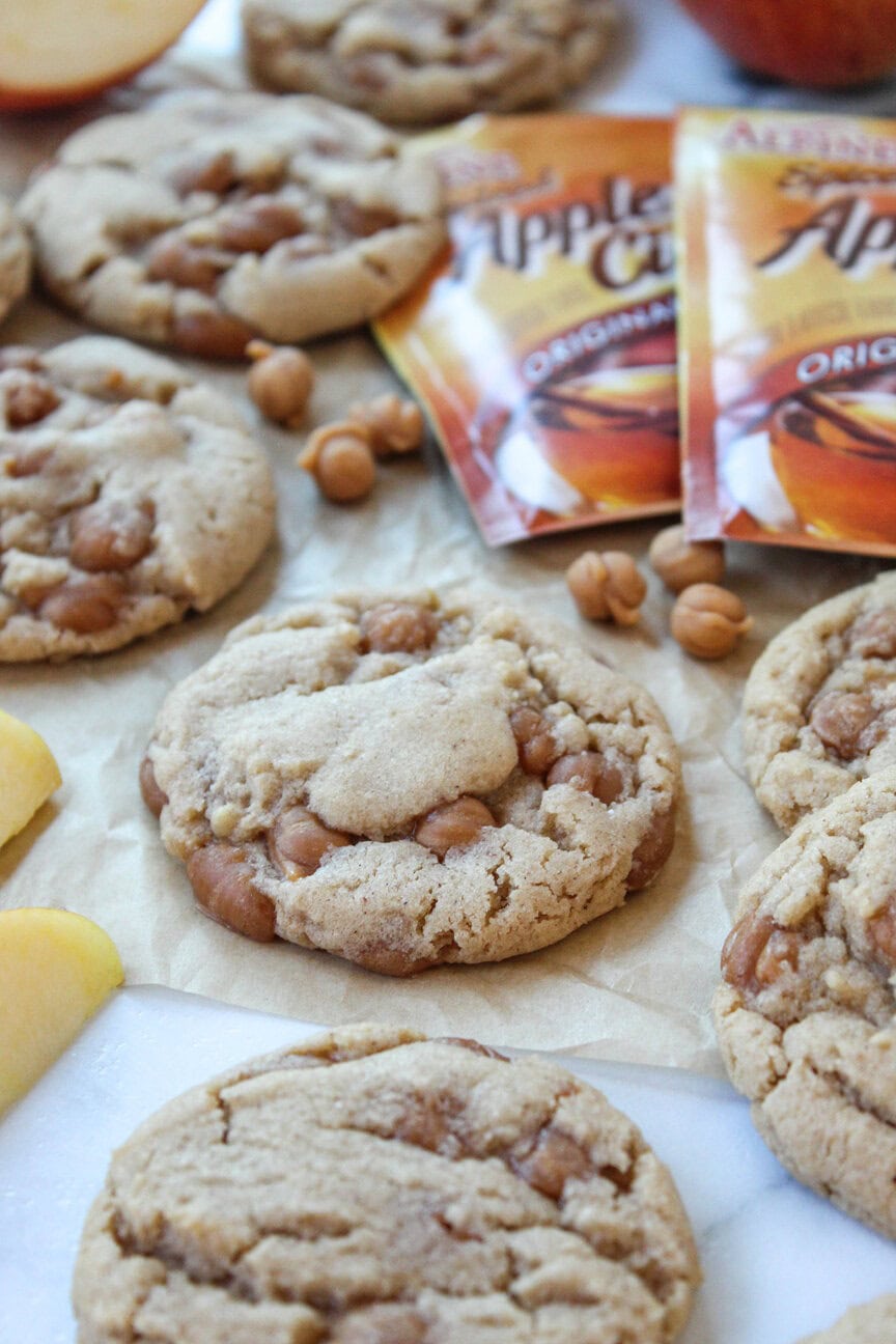 Soft caramel apple cider cookies studded with caramel bits and baked until golden brown