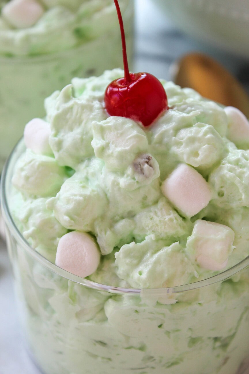 Easy pistachio fluff salad ready to serve at a potluck or holiday table