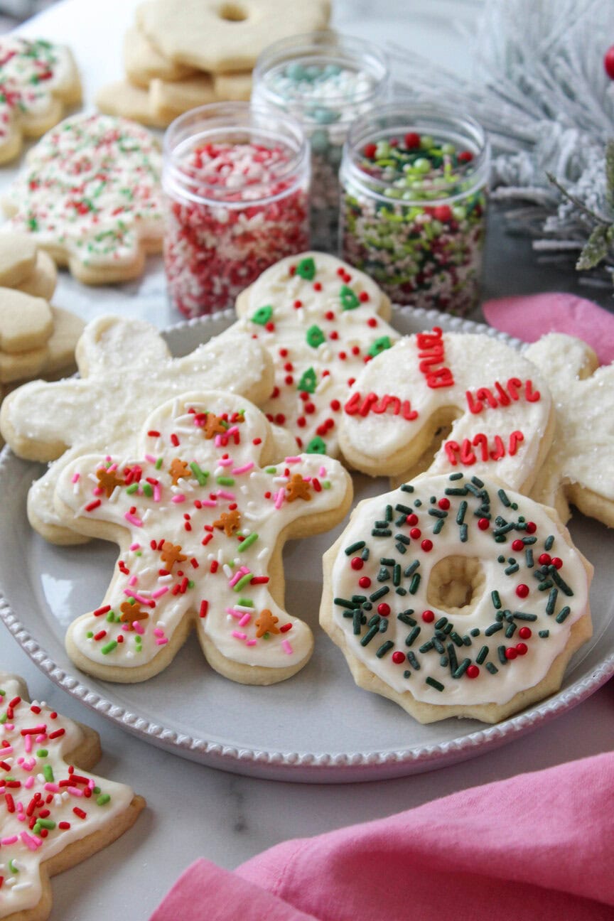 Christmas cutout sugar cookies in holiday shapes with cream cheese frosting
