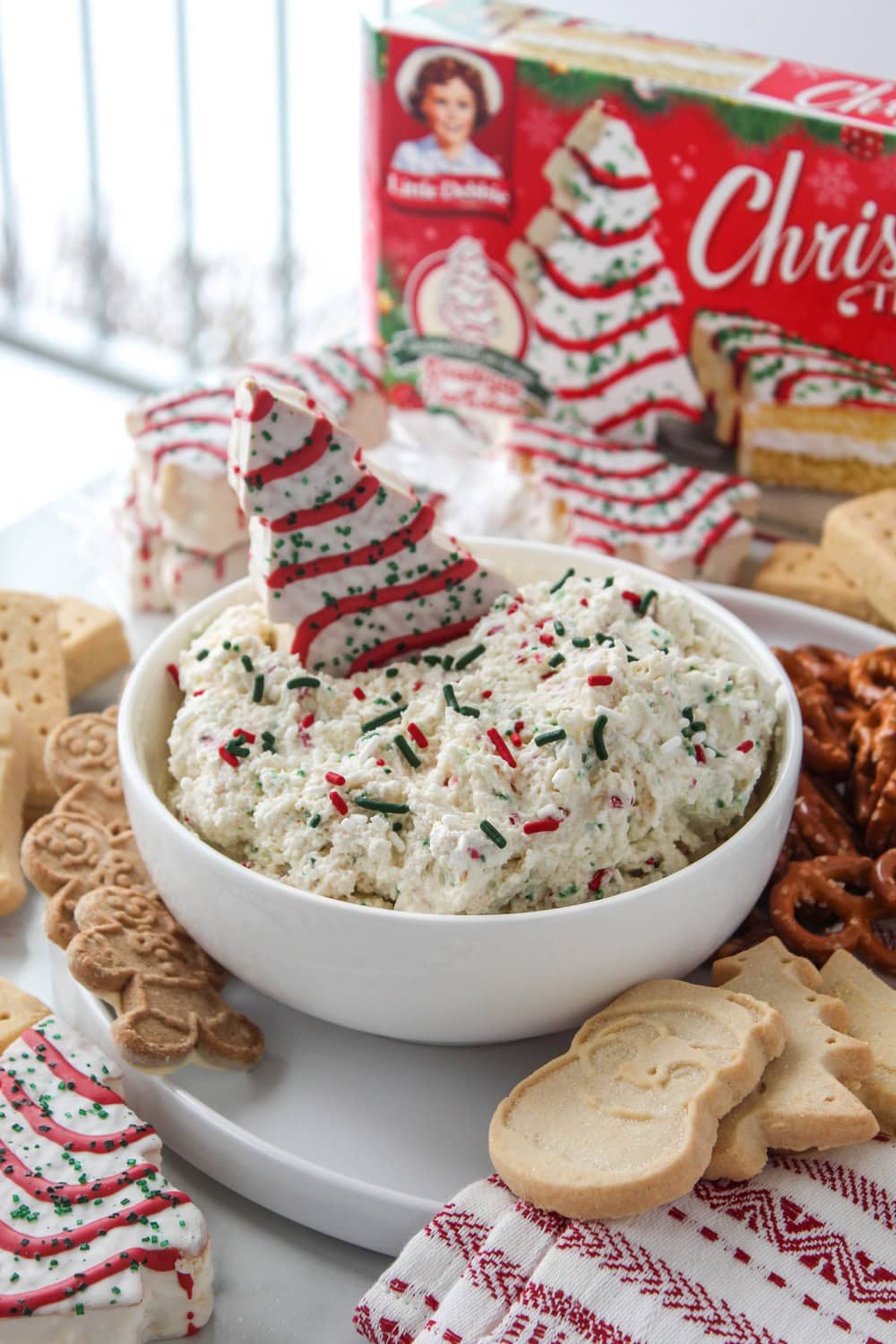 Little Debbie Christmas Tree Cake Dip topped with festive Christmas sprinkles