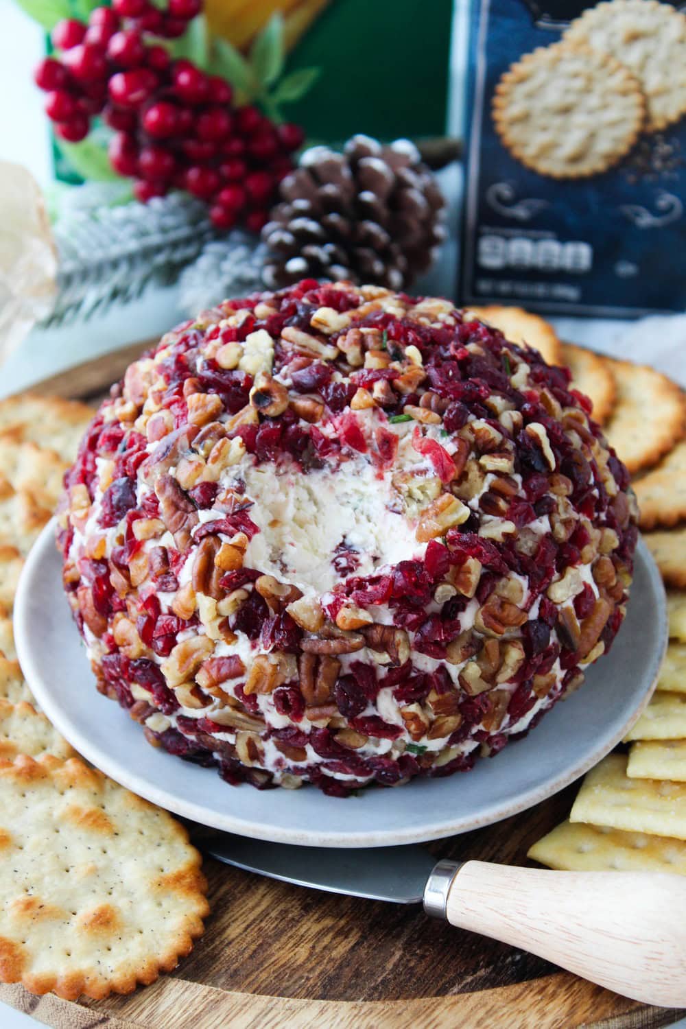 Holiday cranberry pecan cheese ball arranged on a serving platter