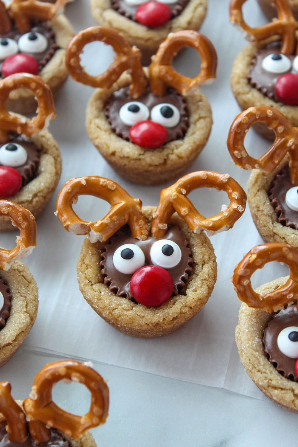 Close‑up of reindeer cookies made with mini Reese’s cups and red M&M noses