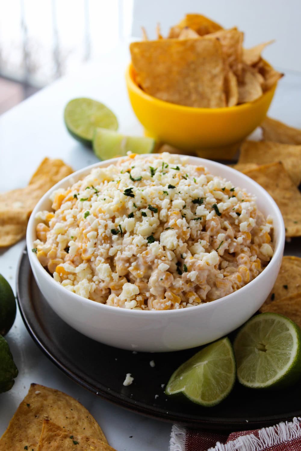 Mexican street corn dip topped with cheese and chili seasoning