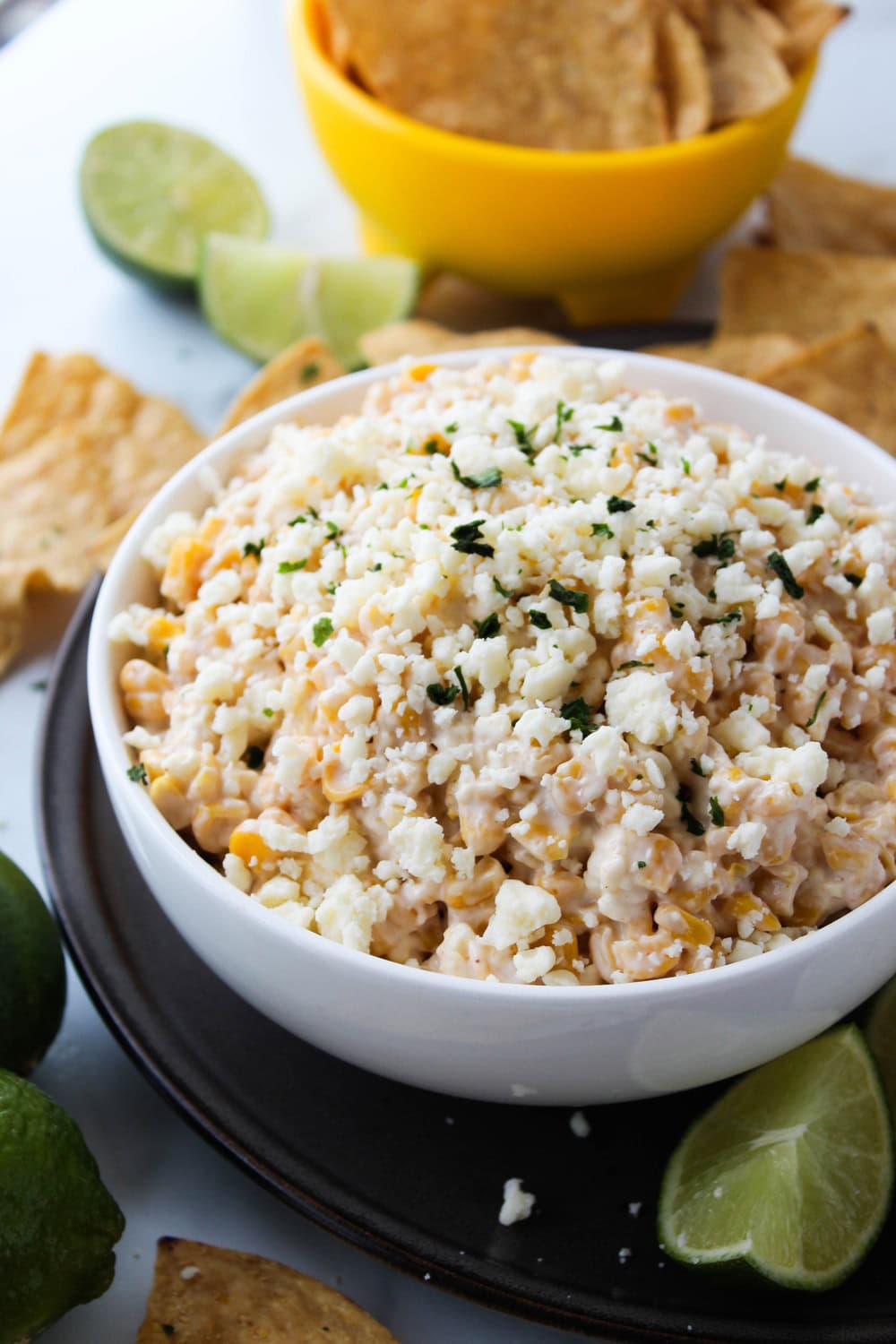 Creamy Mexican street corn dip served with tortilla chips