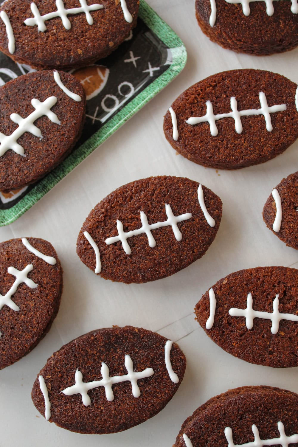 Football-shaped brownies decorated with white icing laces