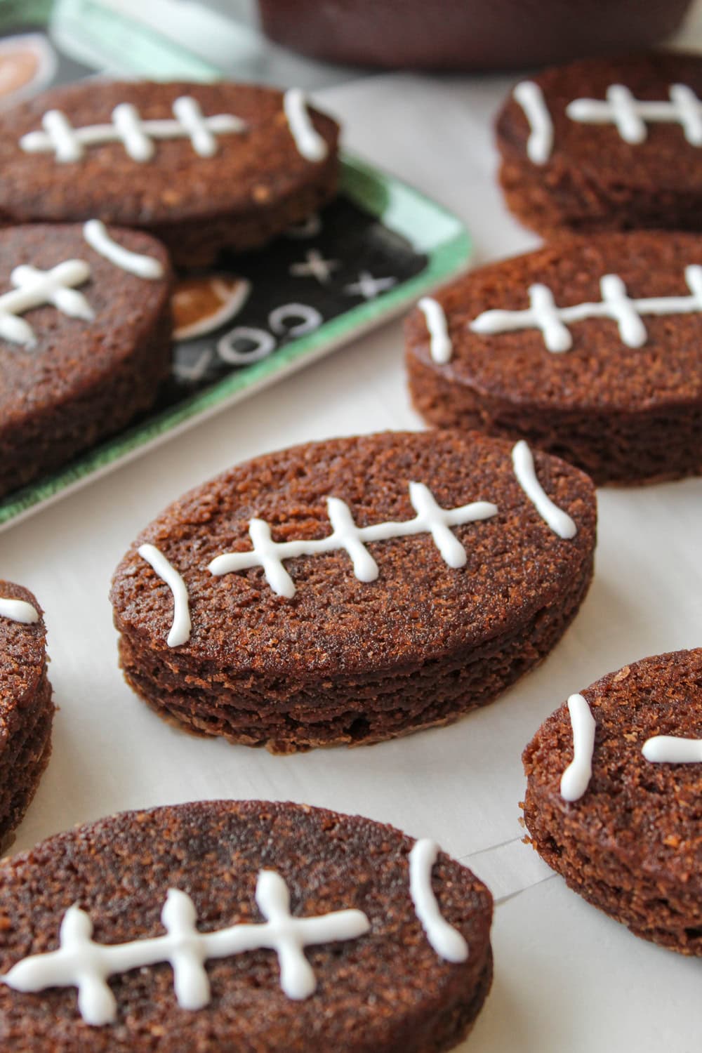 Fudgy football brownies with piped frosting details