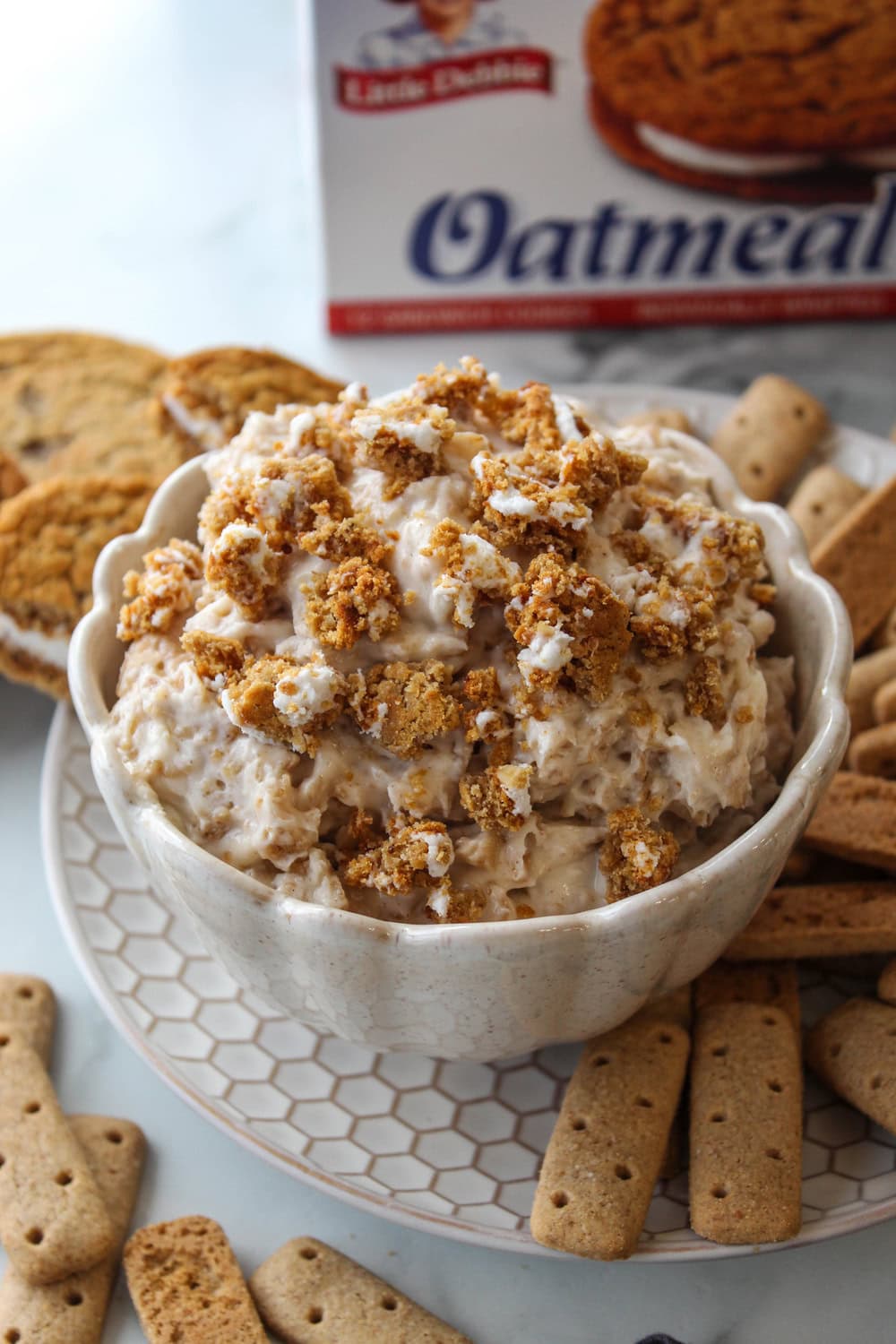 Fluffy no-bake Oatmeal Cream Pie dip with cinnamon and cookie crumbles