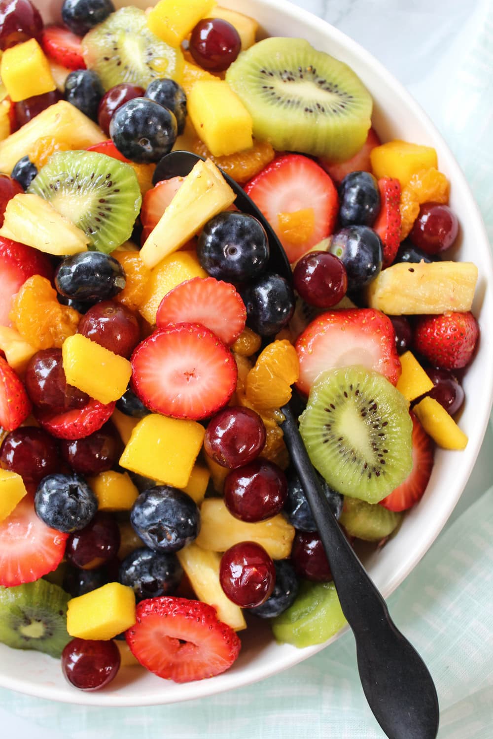 Refreshing fruit salad with honey lime glaze served chilled