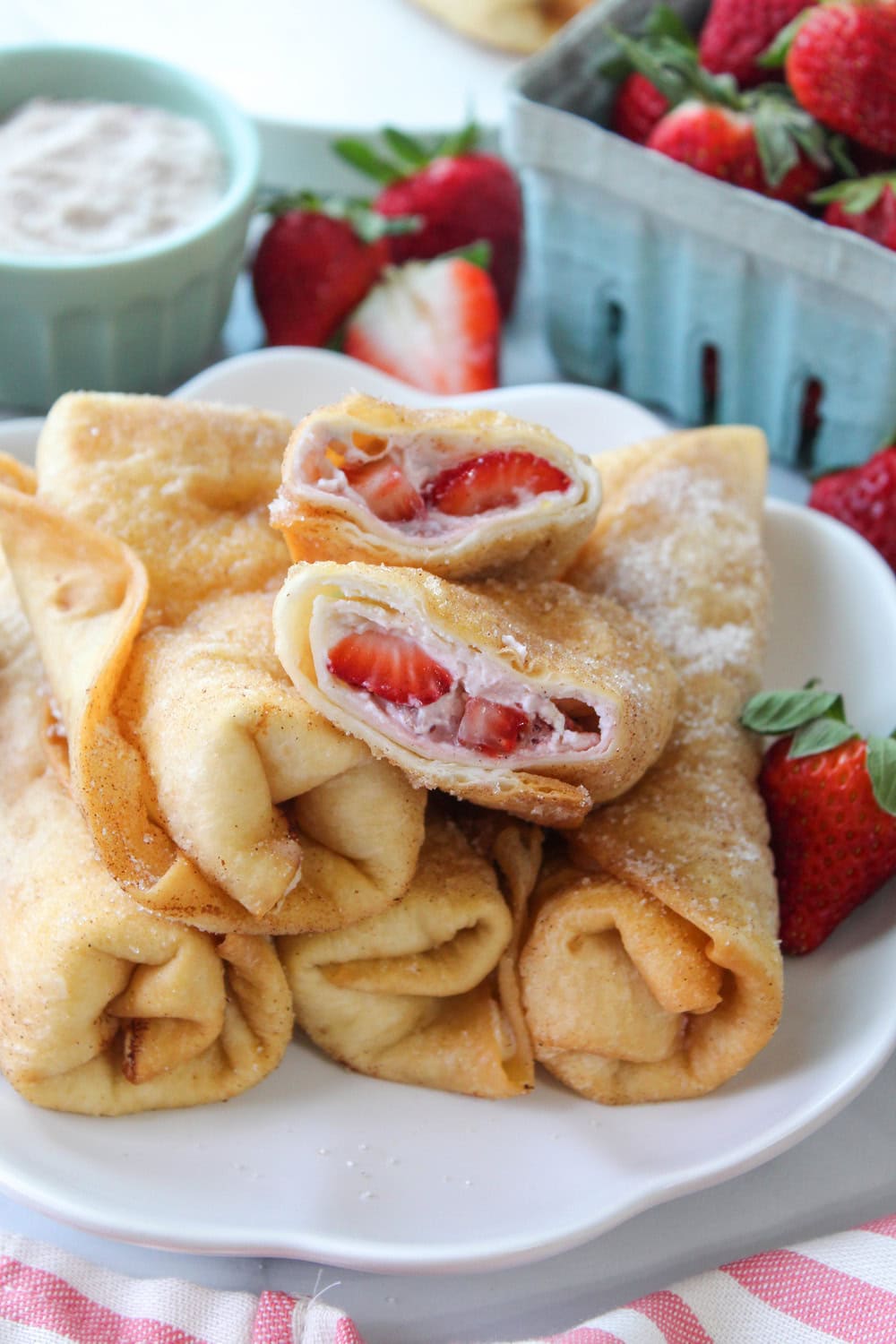 Dessert chimichangas filled with strawberry cheesecake and coated in cinnamon sugar